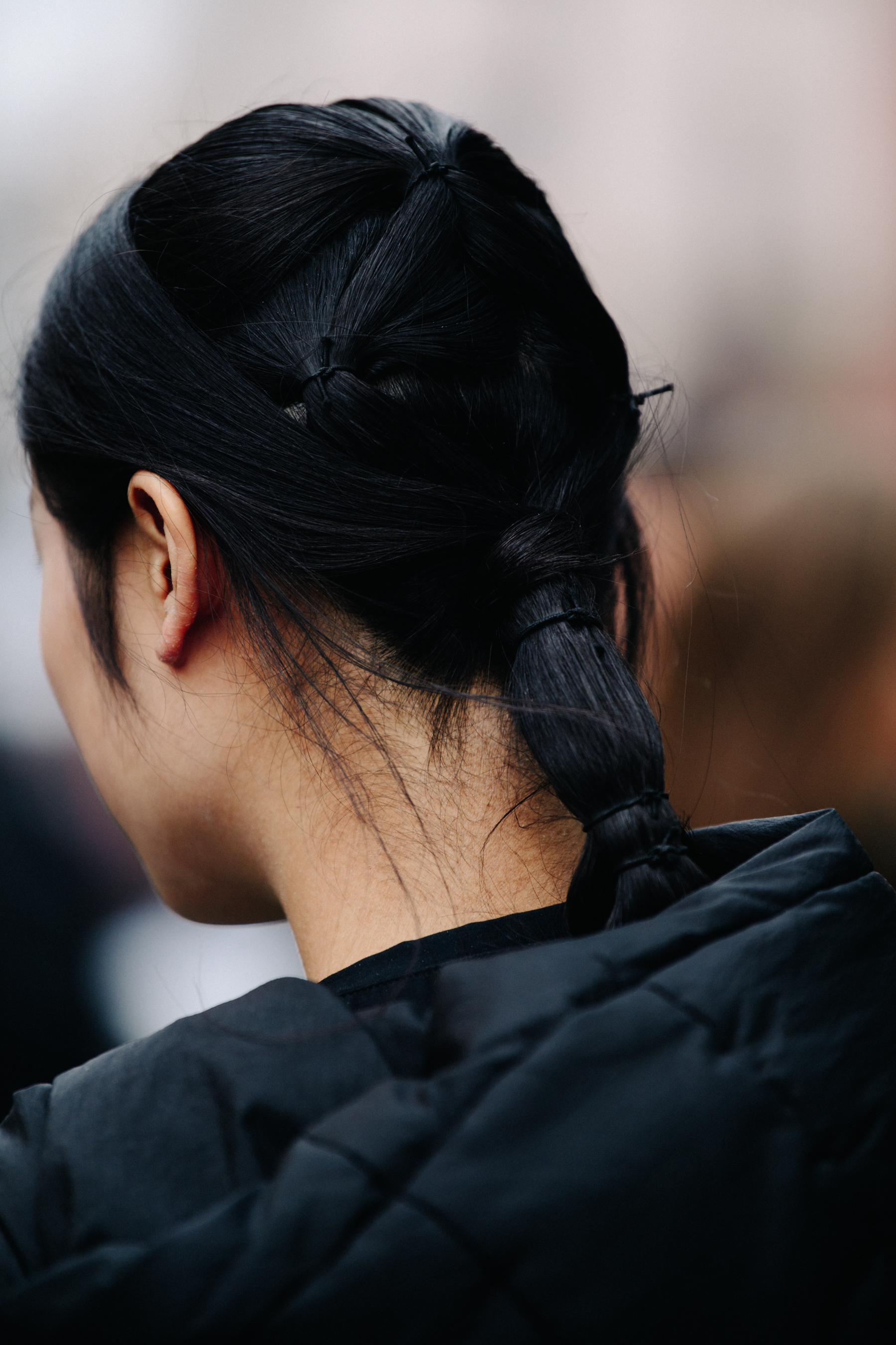 Model with hair tied back