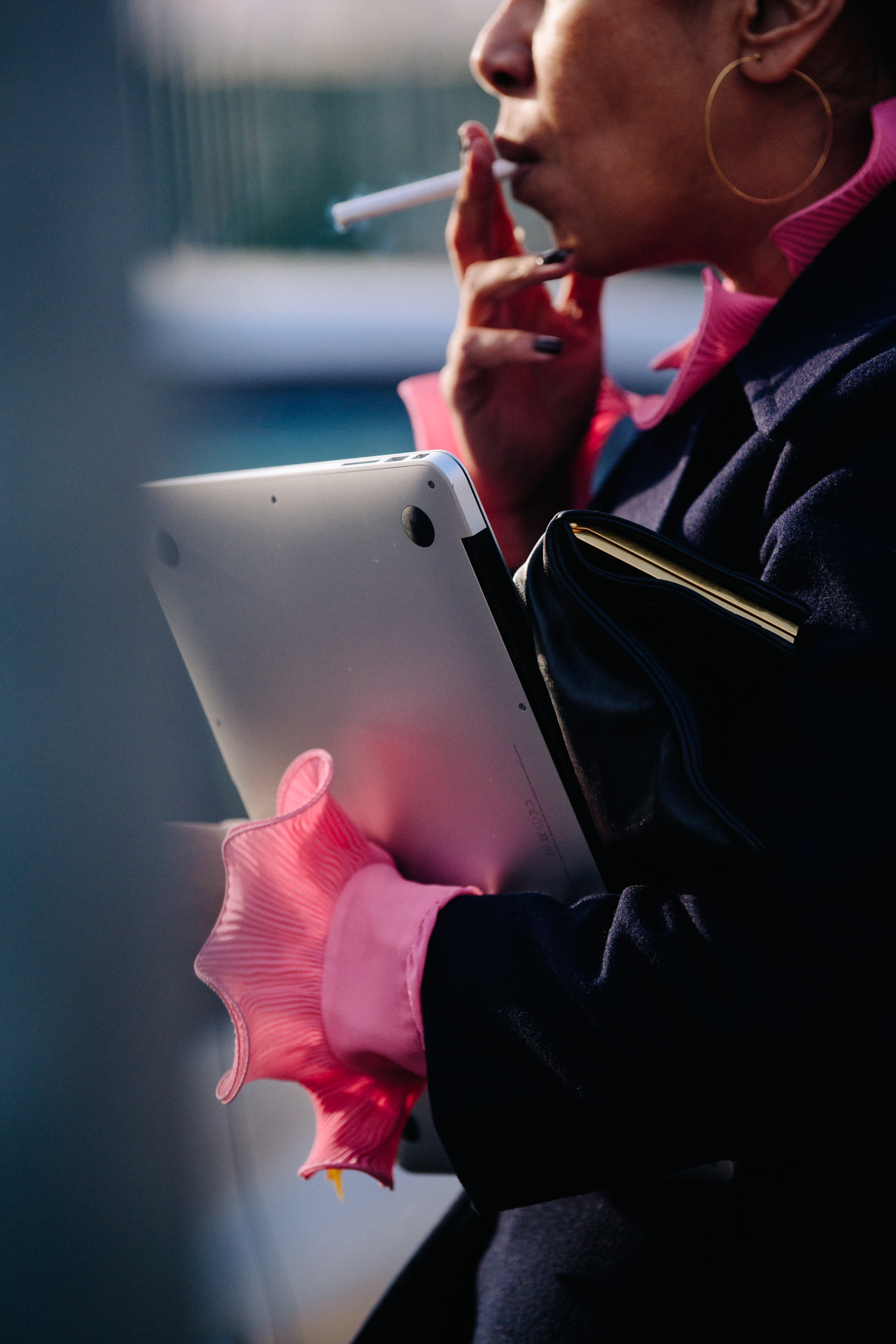 Woman carrying silver MacBook