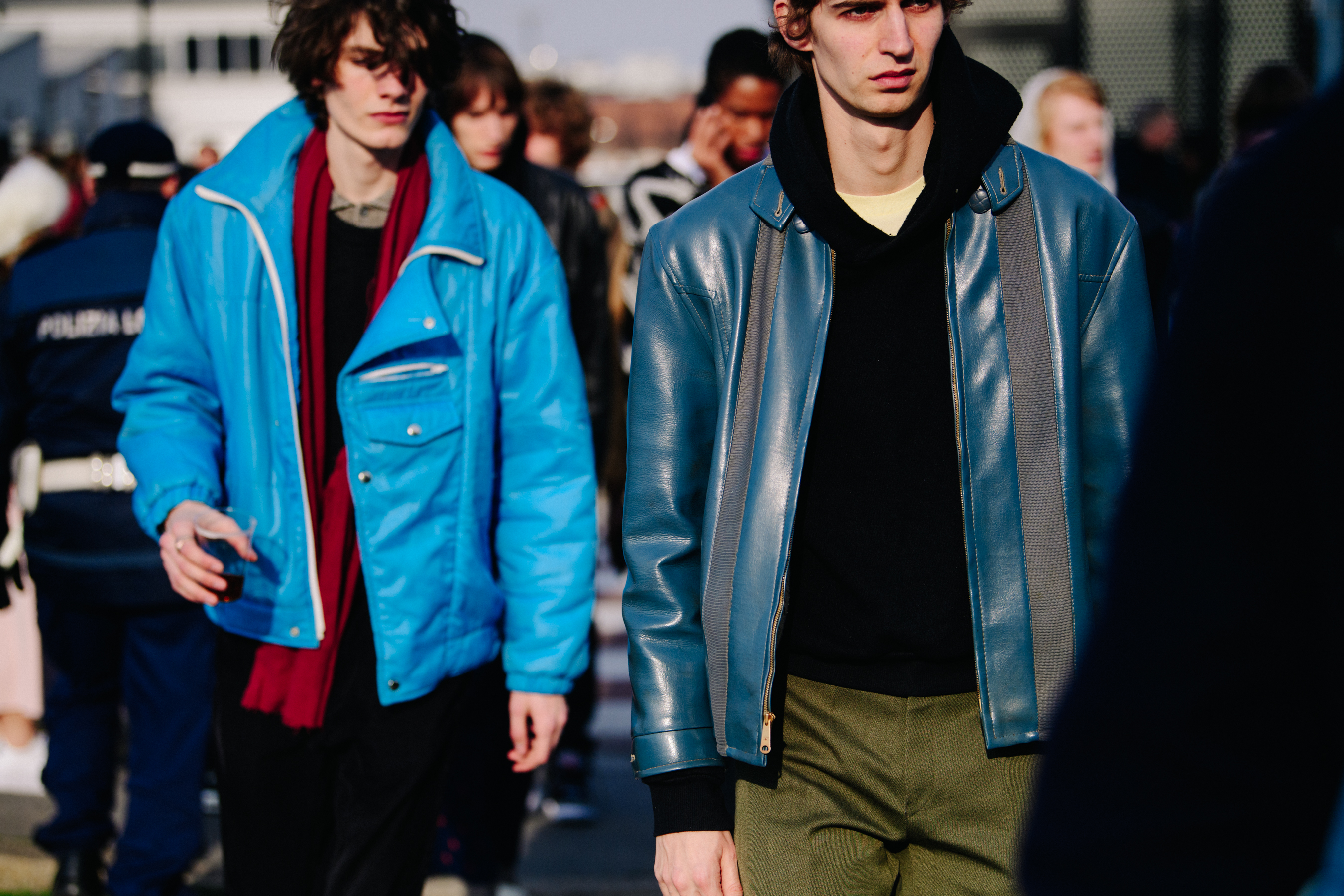 Two male models wearing blue jackets
