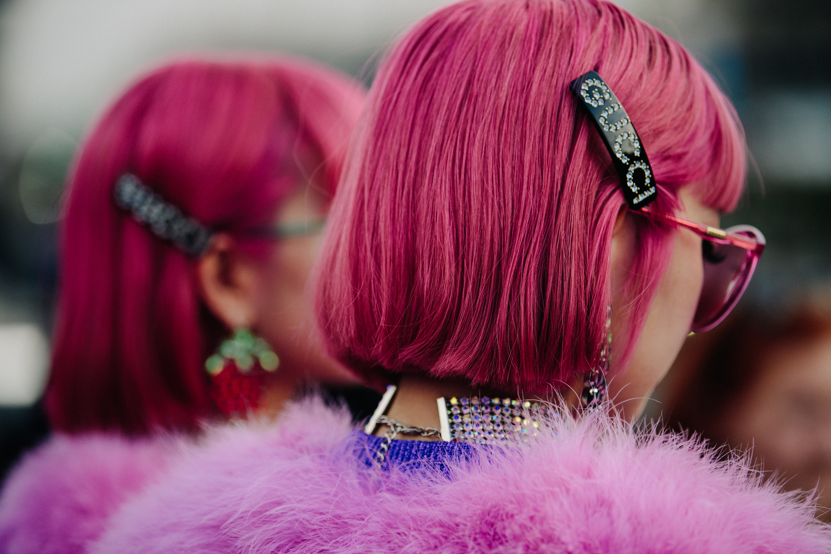 Two Asian women with pink hair