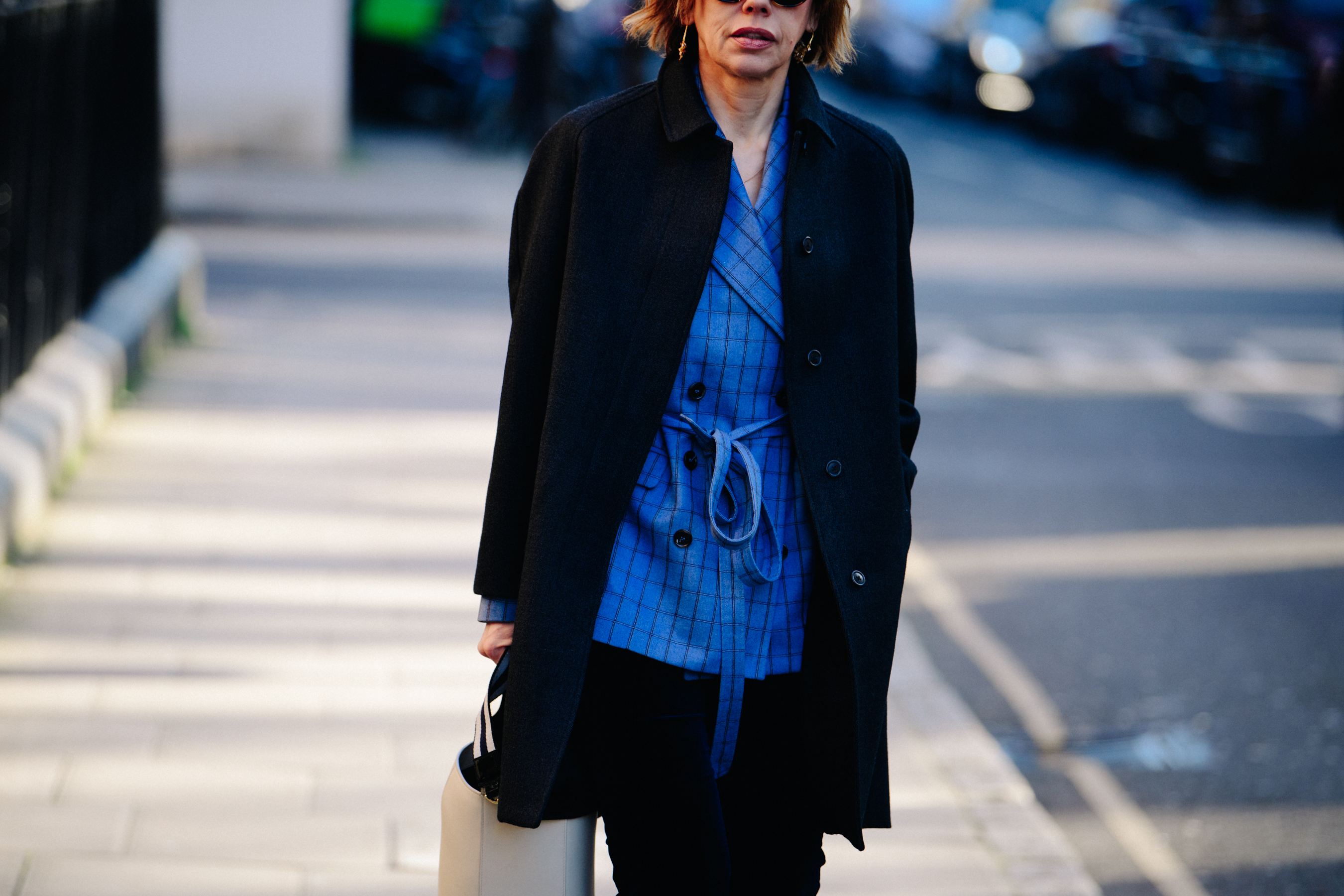 Woman wearing blue check blazer