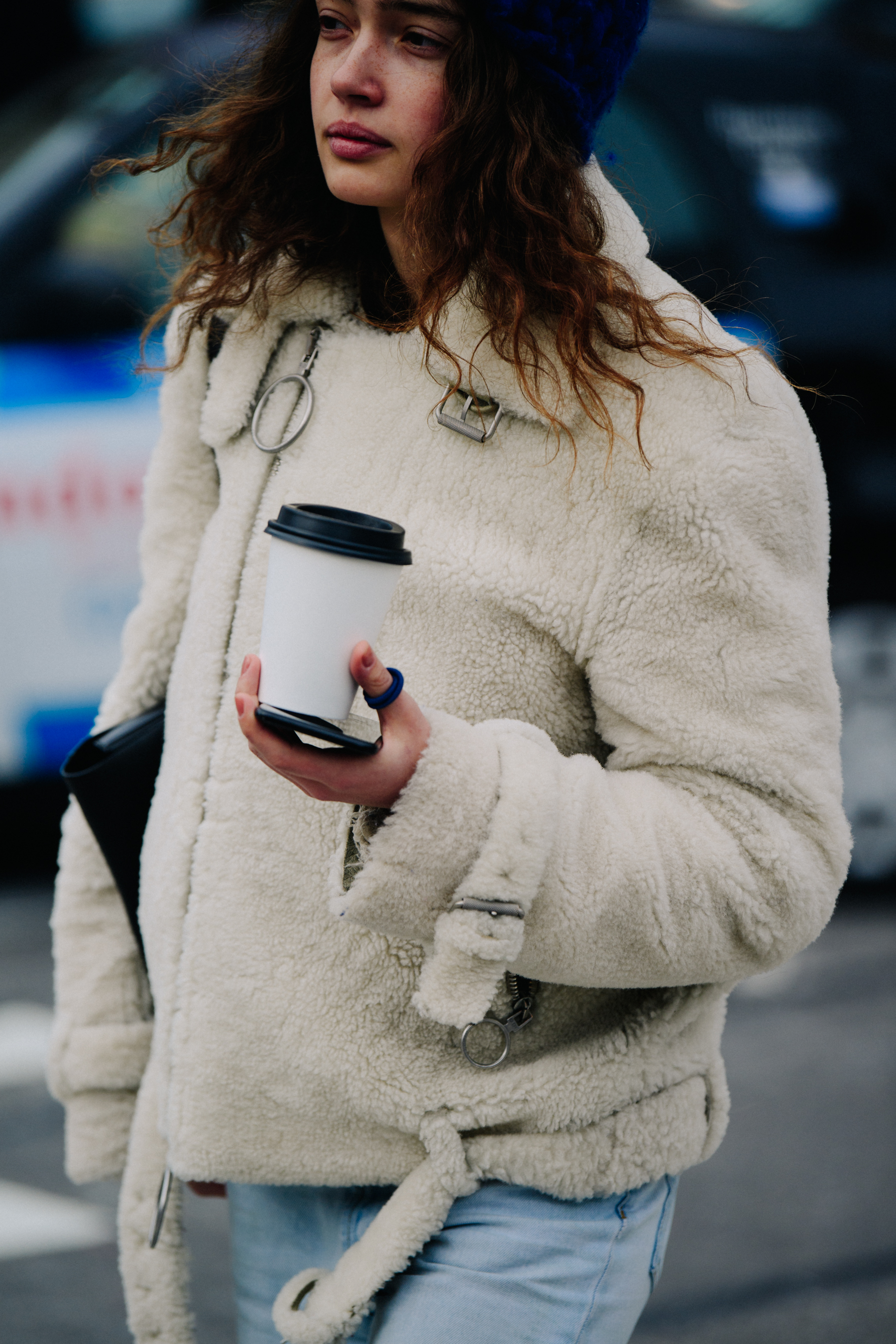Model wearing white fur jacket