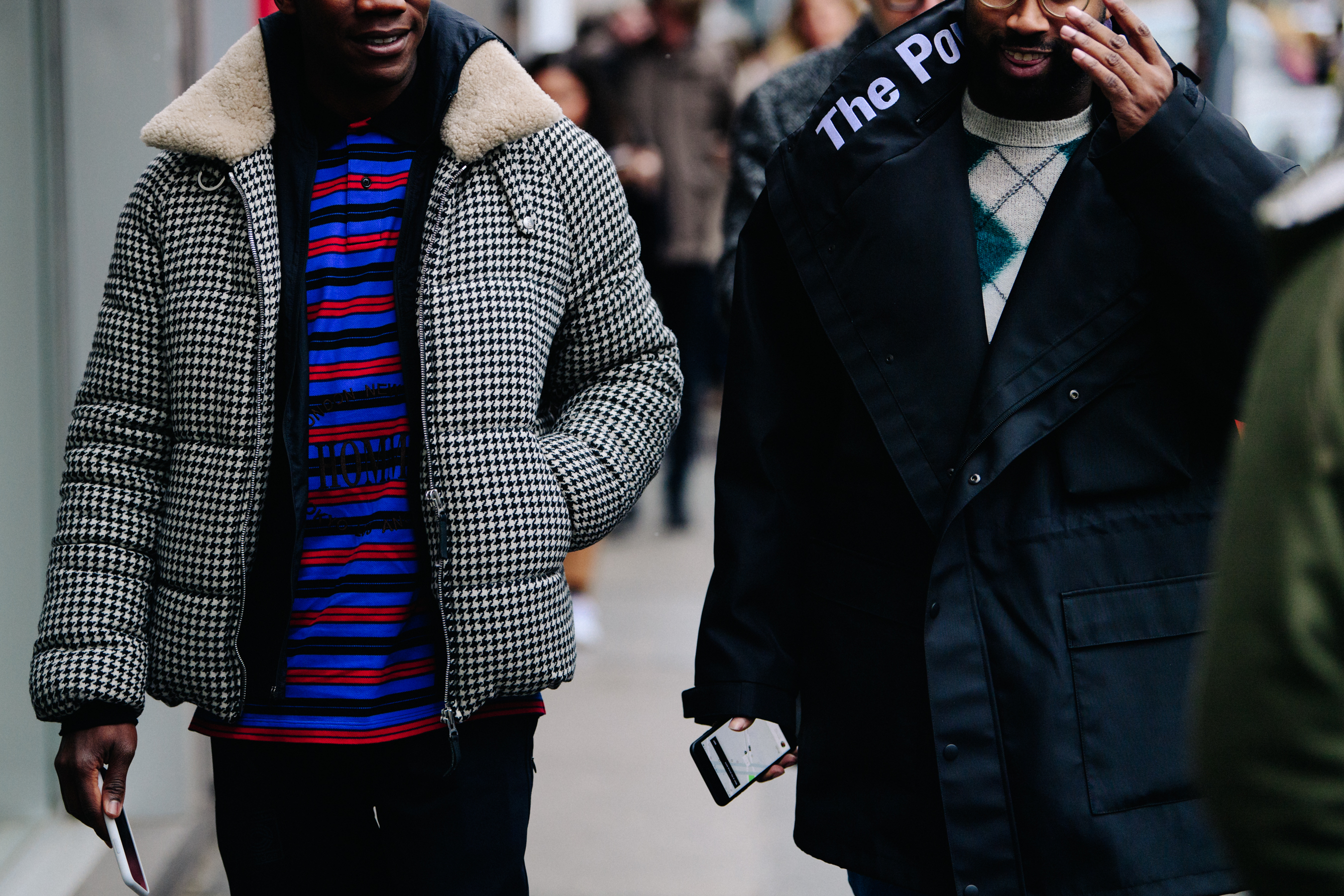 Two men wearing winter coats