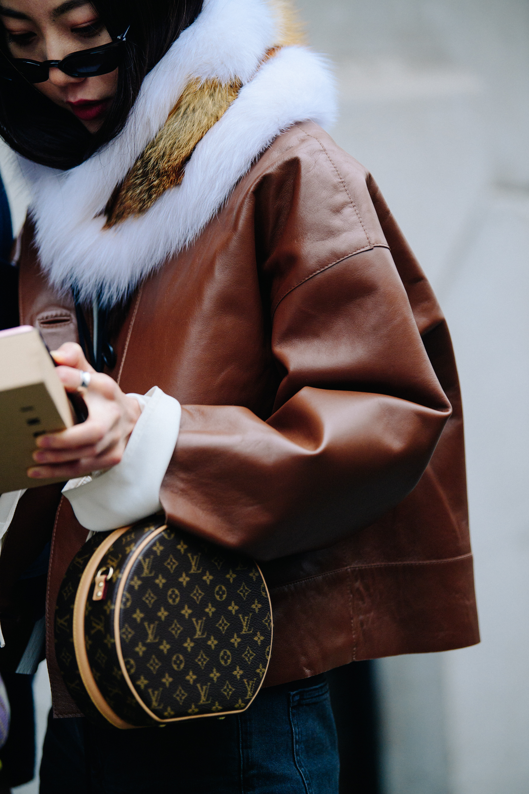 Woman holding Louis Vuitton bag