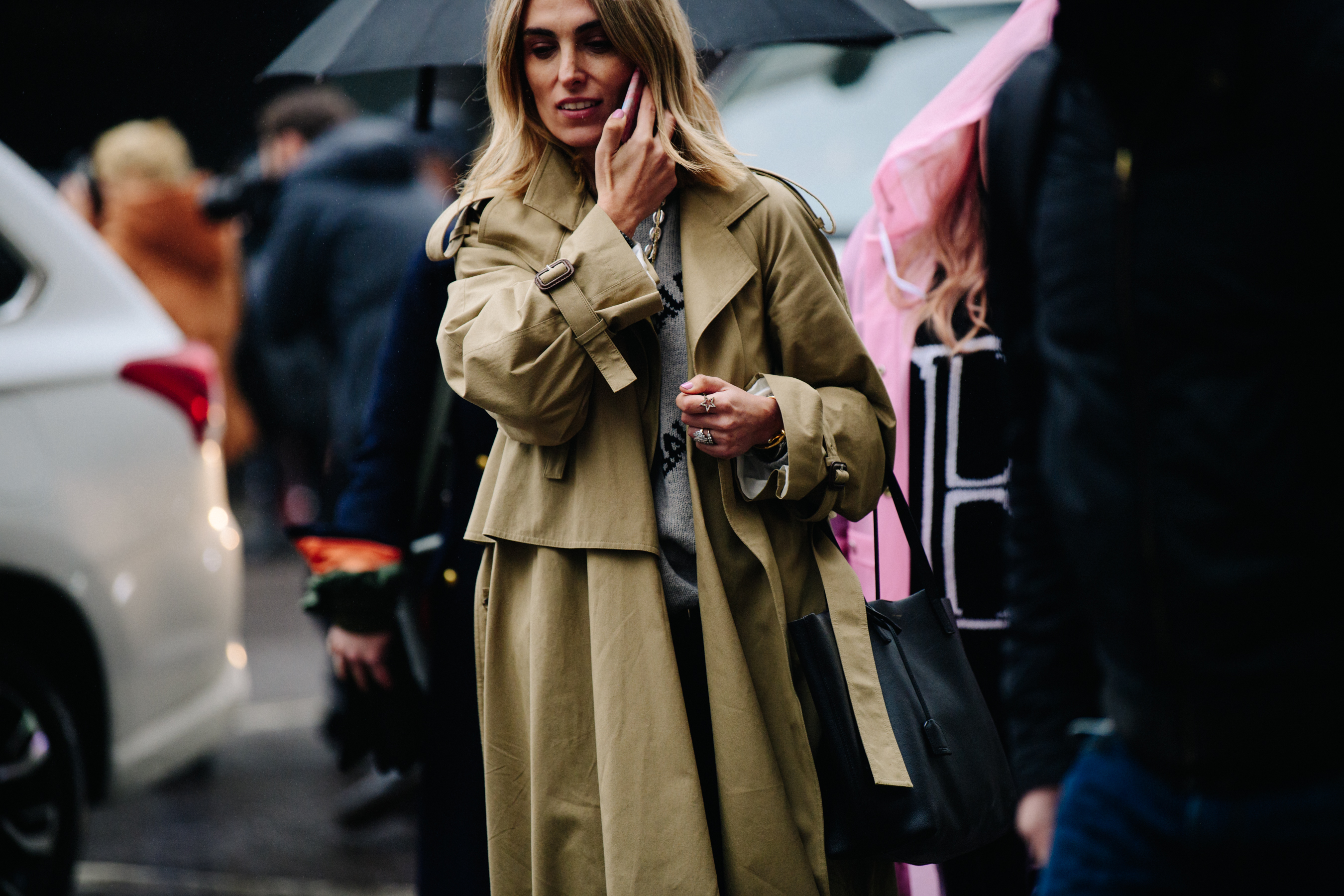 Buyer wearing tan coat