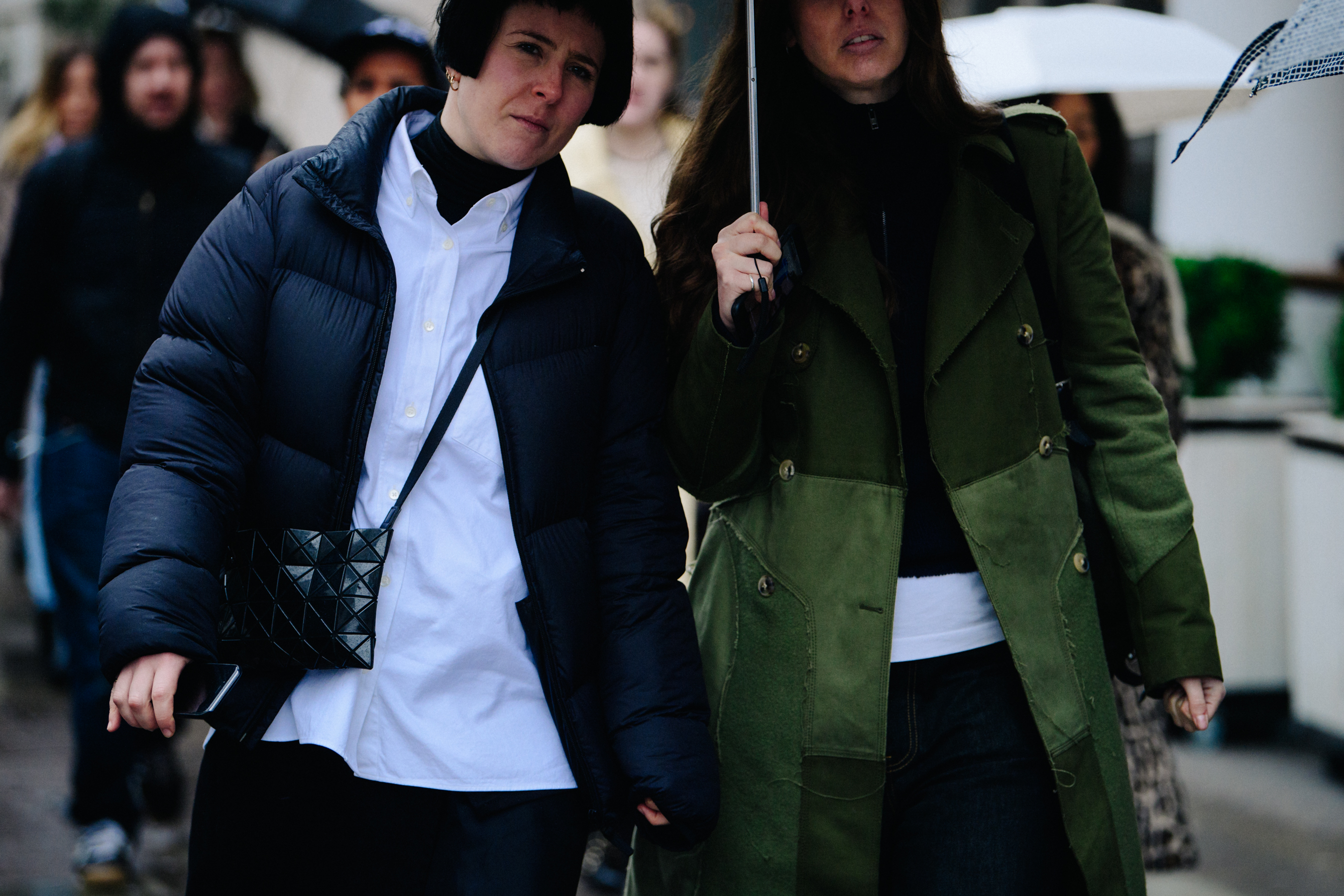 Two women under umbrella