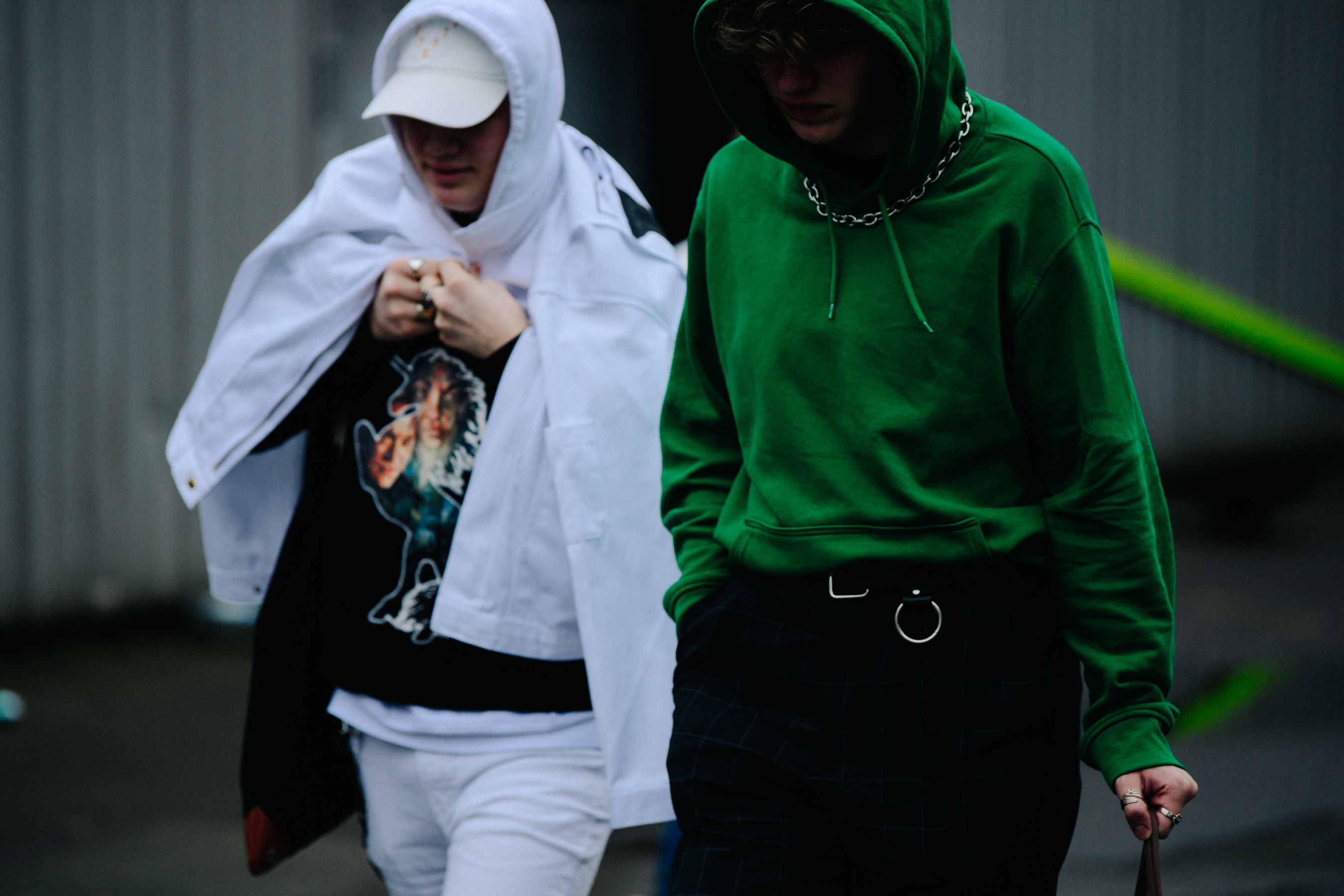 Two men wearing hoodies