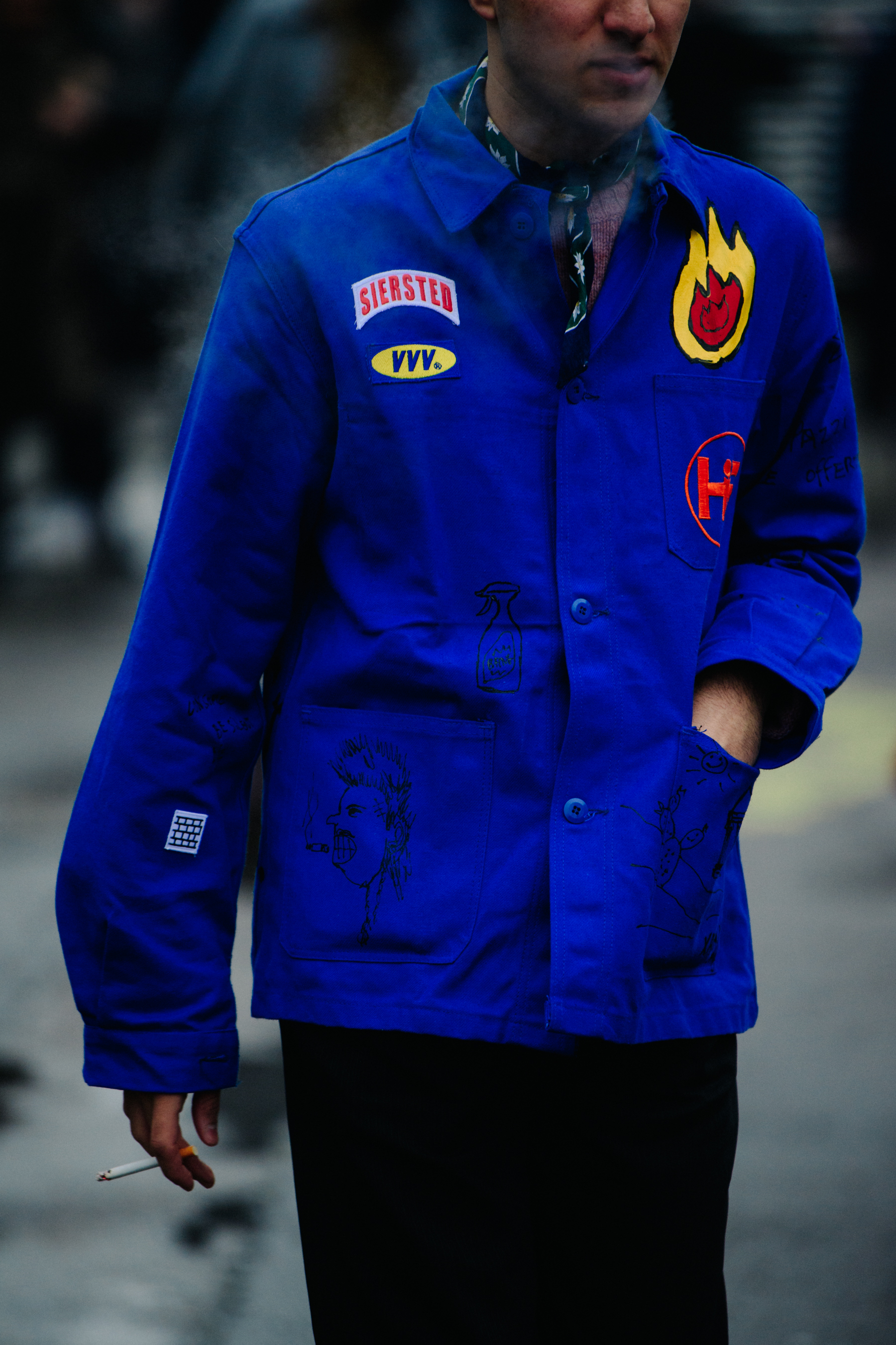 Man wearing blue patched jacket