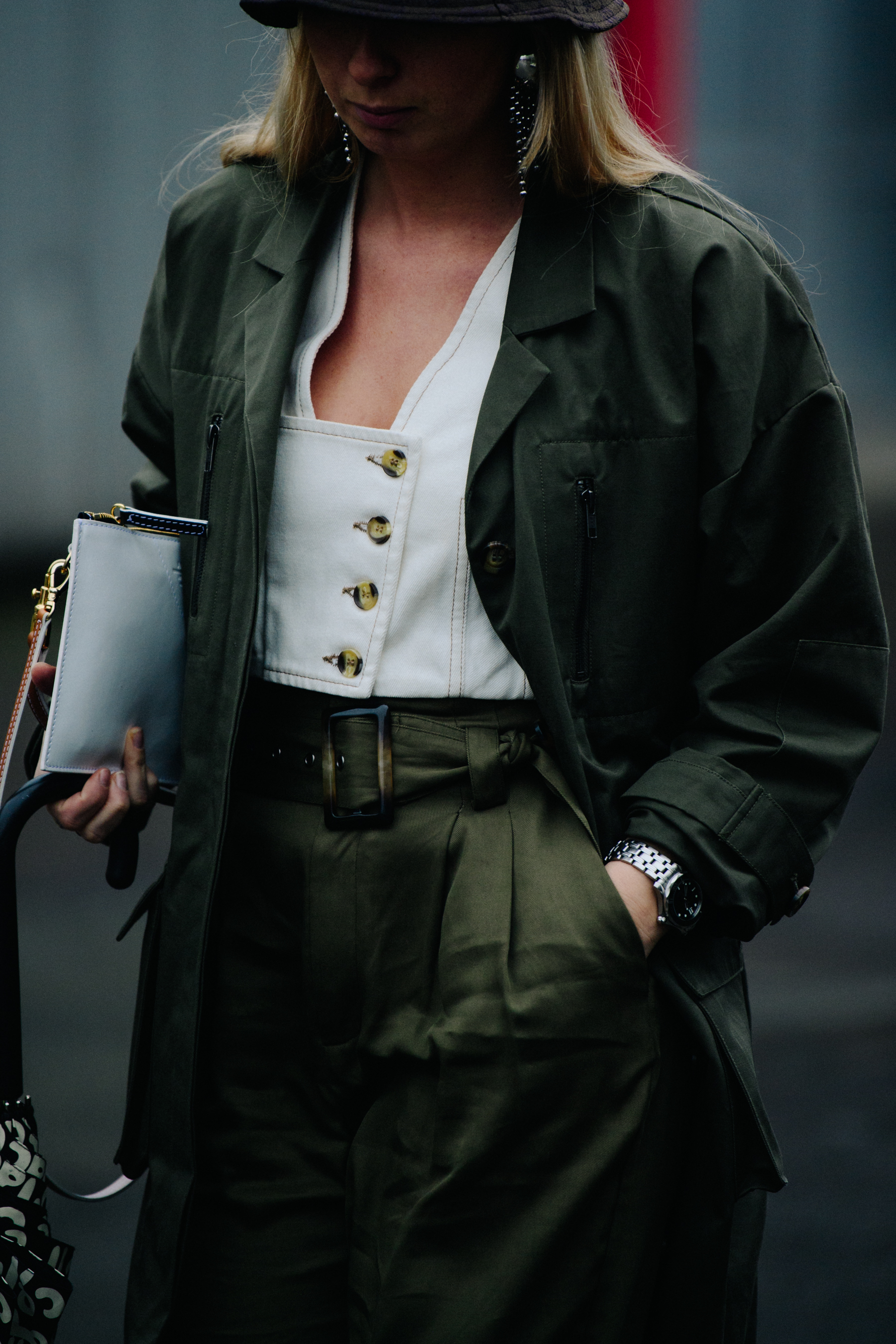Woman wearing green coat and pants