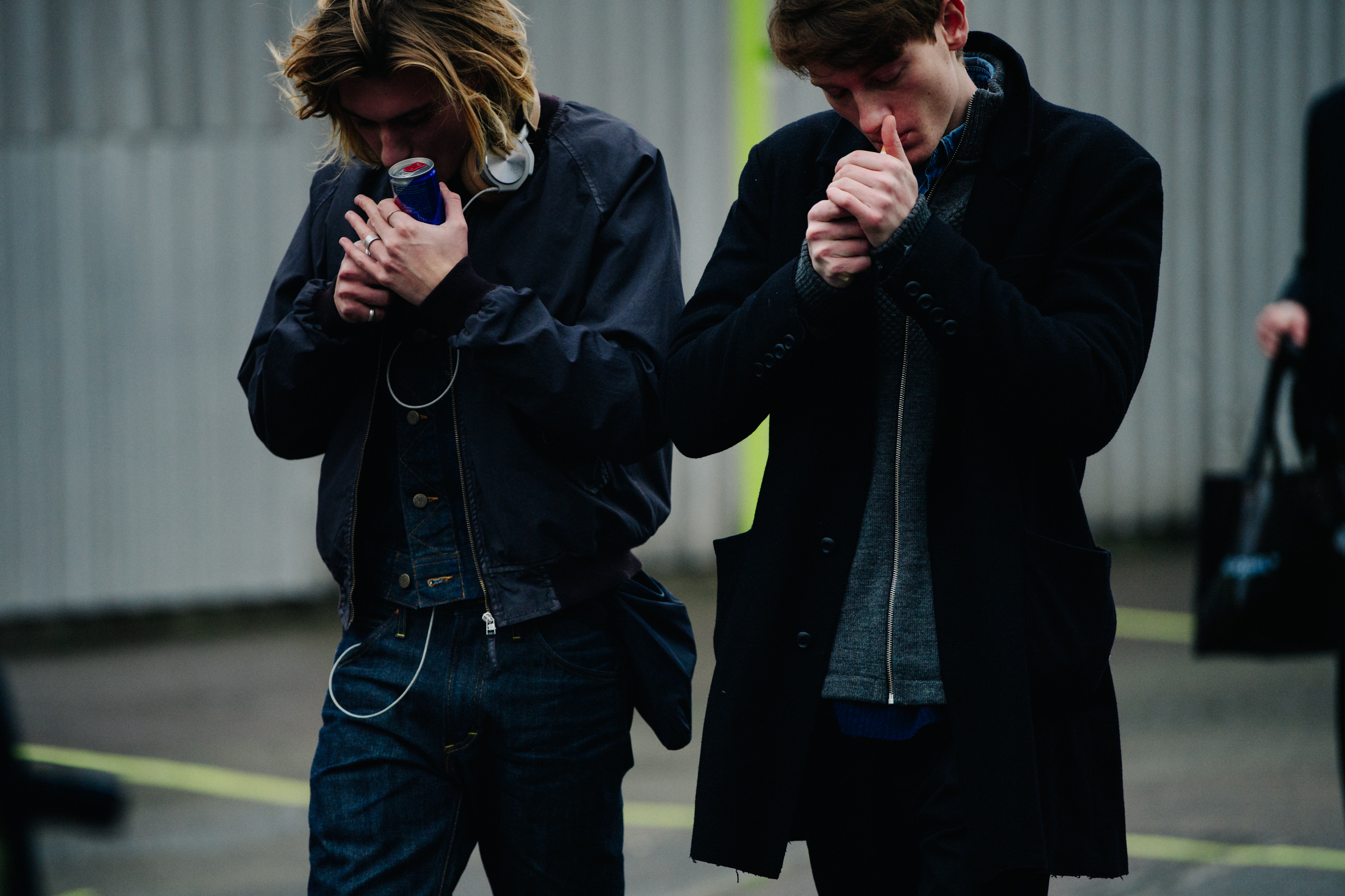 Two models wearing black outfits