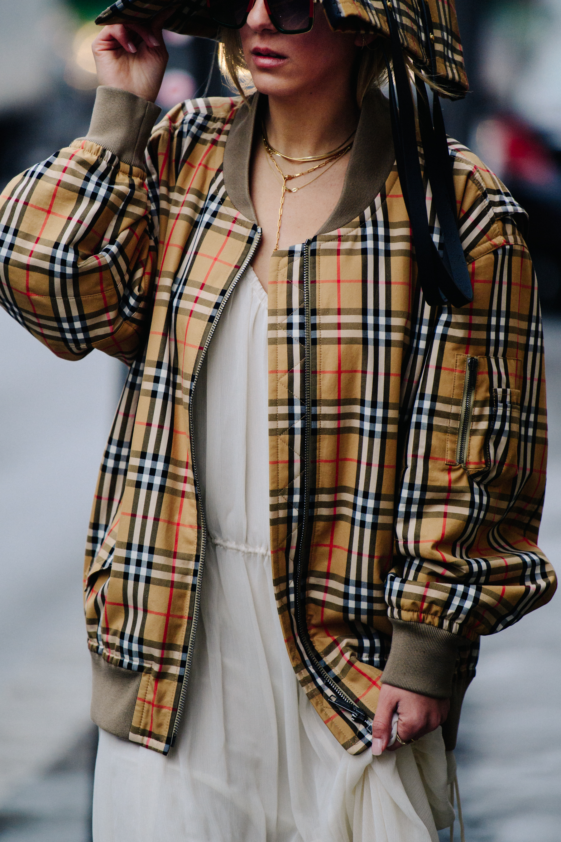 Woman wearing Burberry bomber jacket
