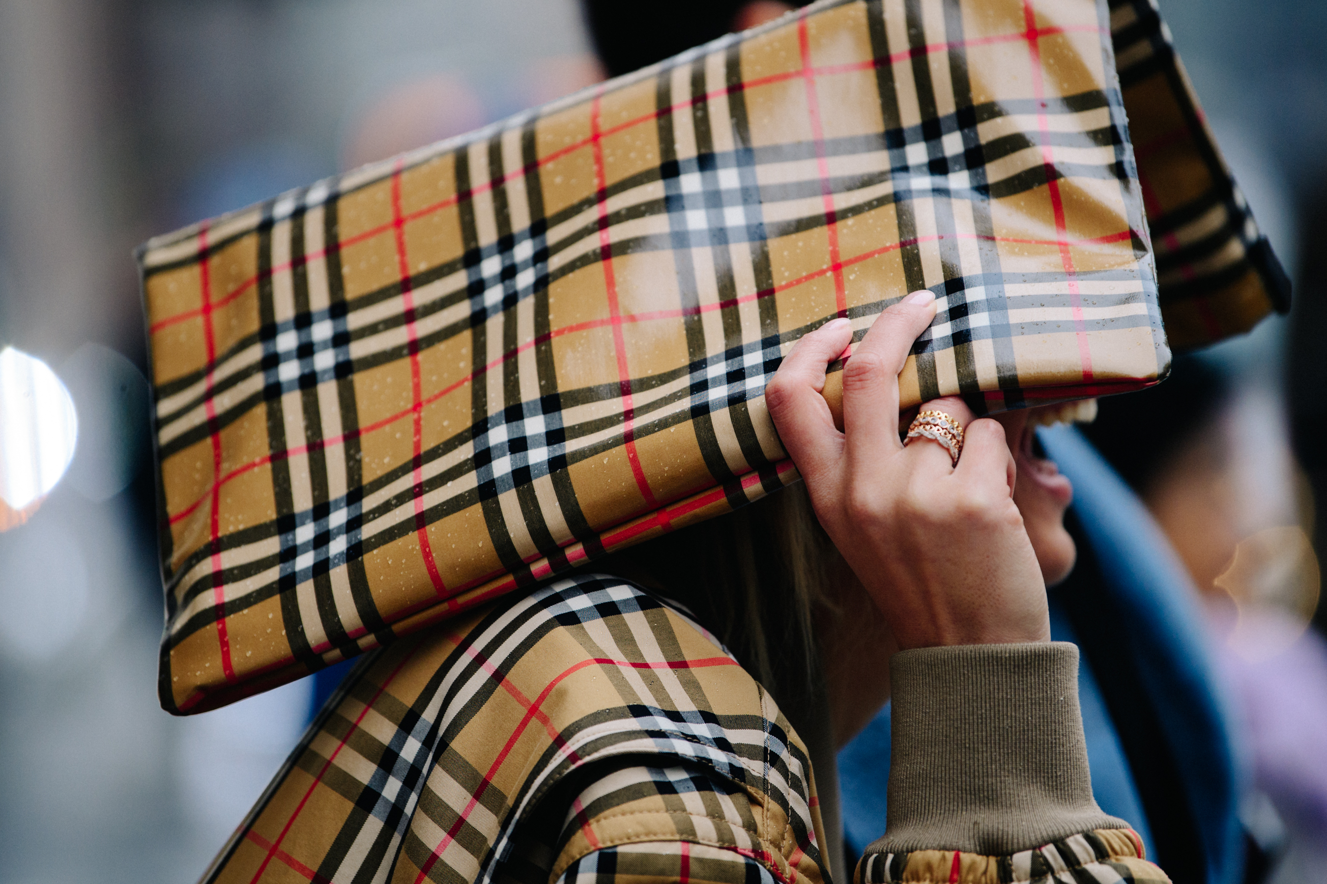 Woman carrying Burberry bag