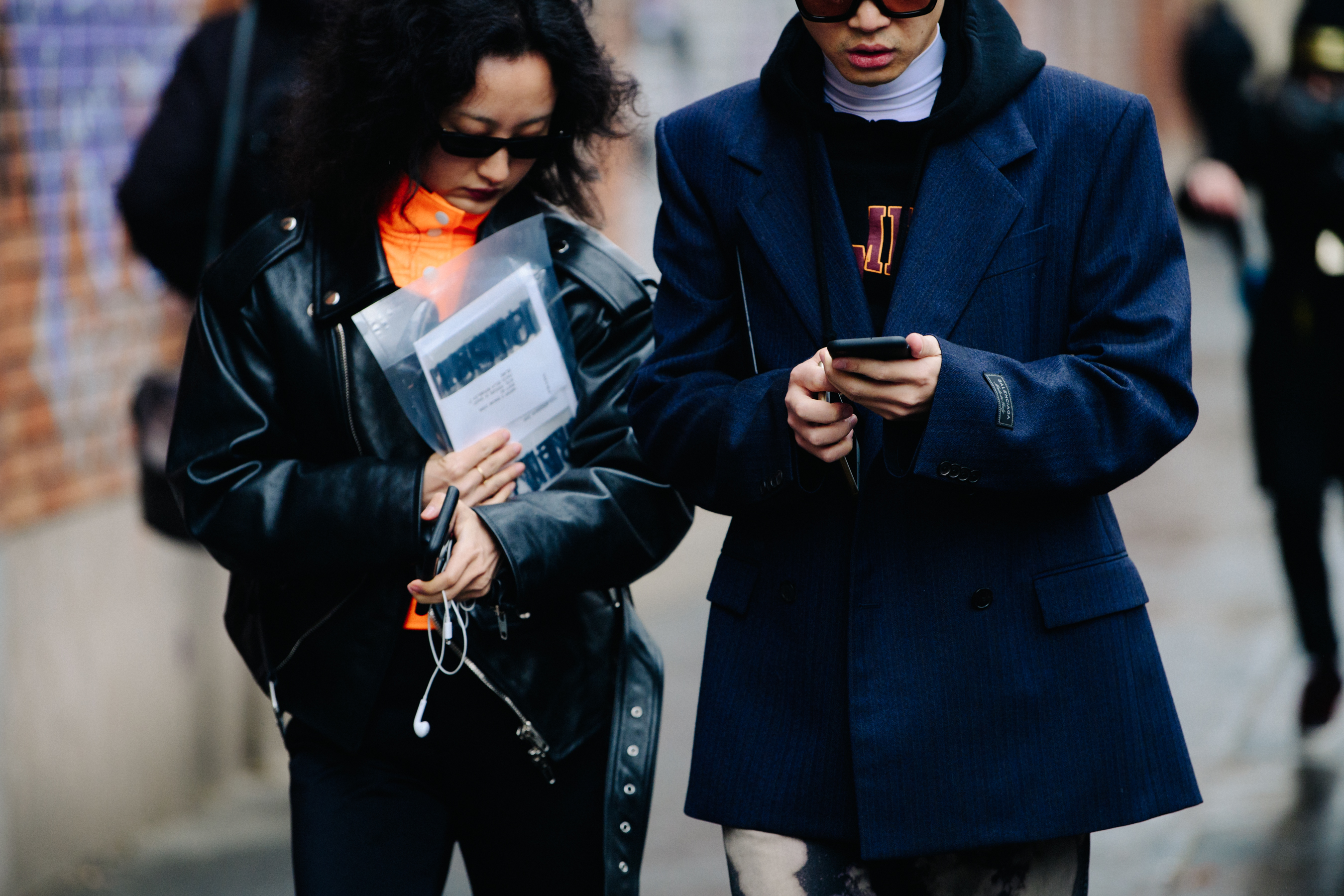 Asian couple wearing dark outfits
