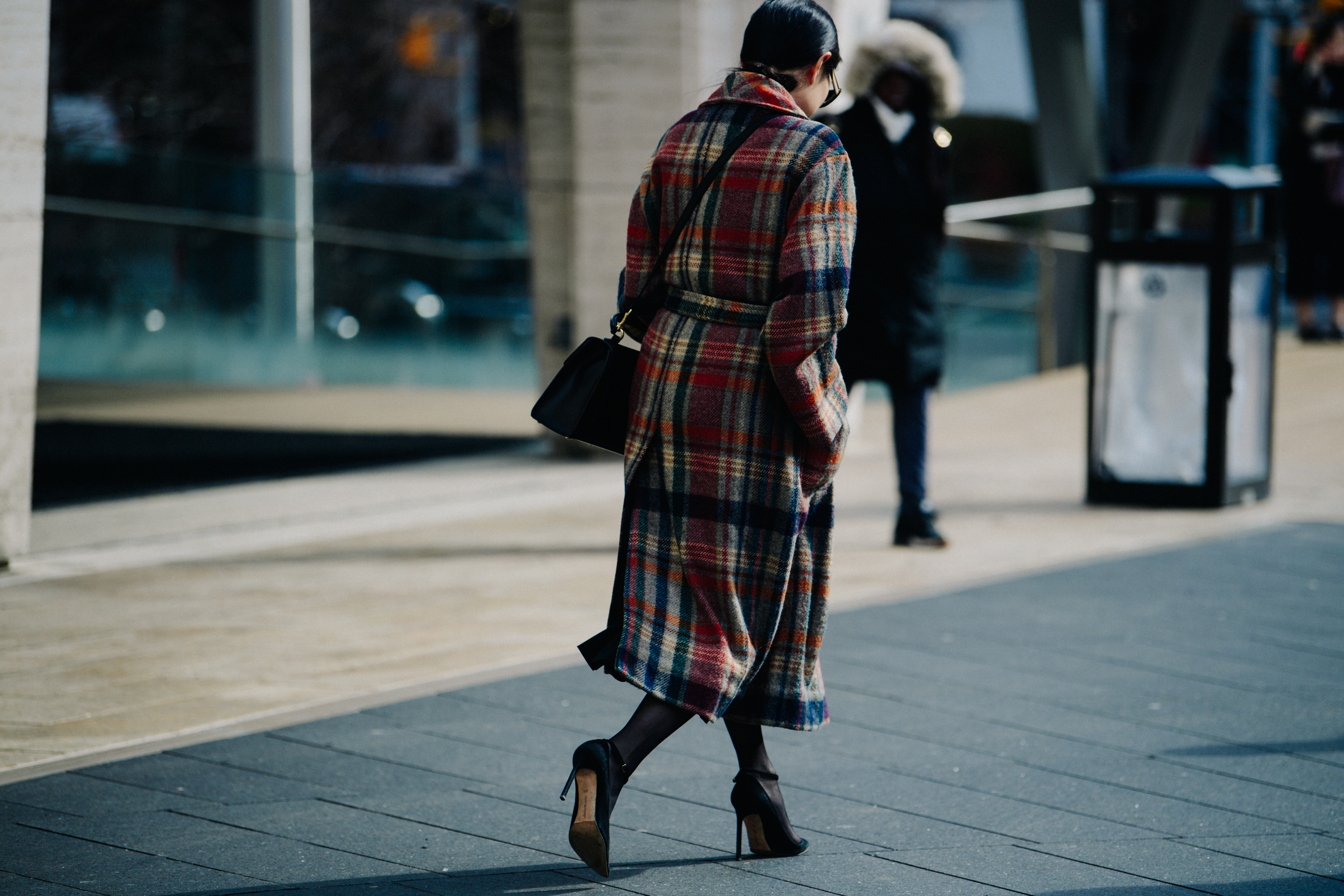 Woman wearing red check coat