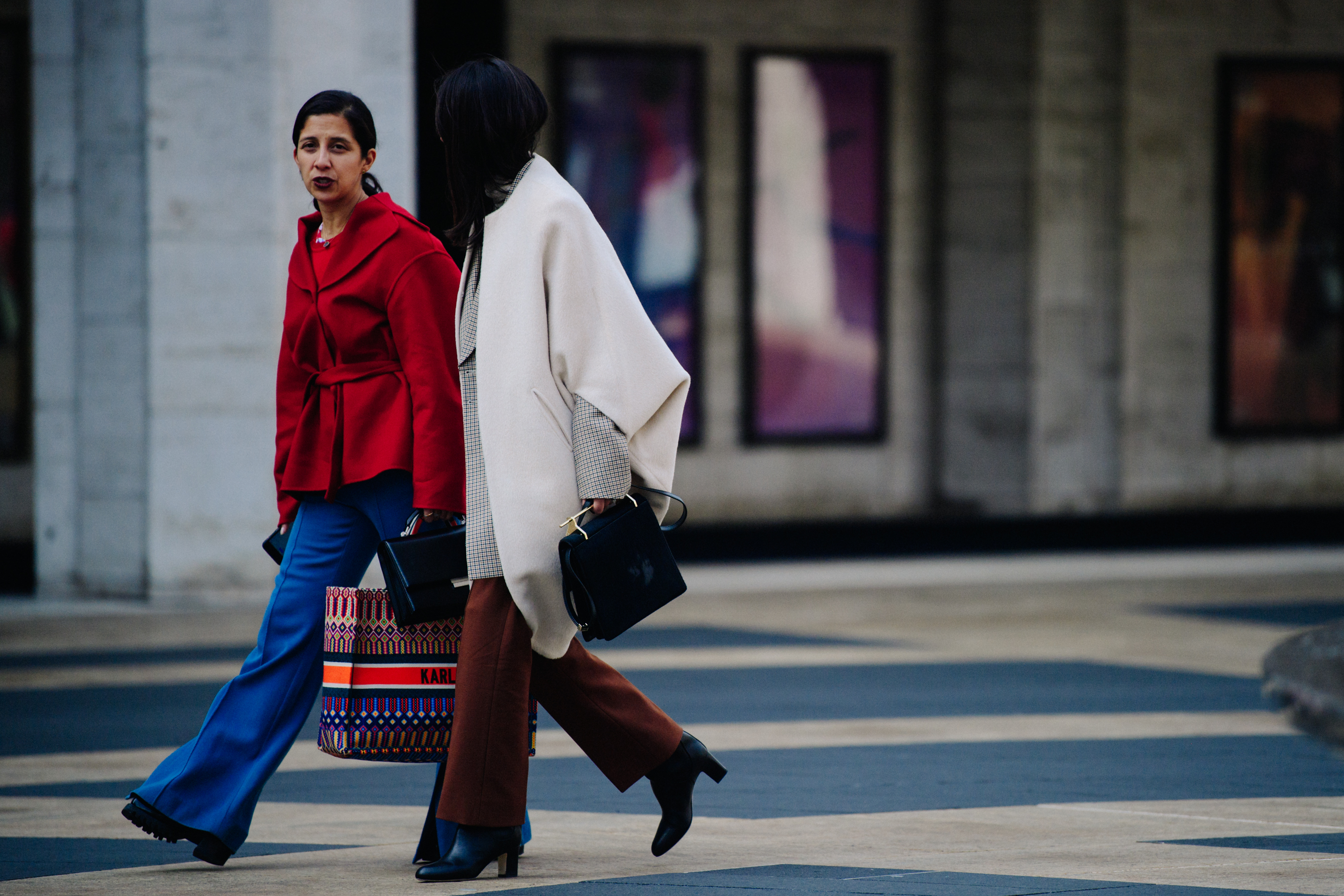 Two women wearing white and red