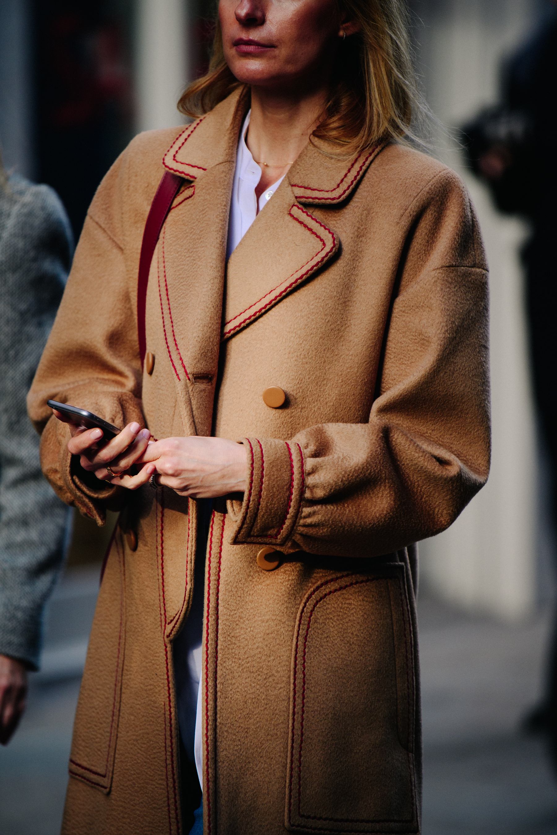 Woman wearing camel wool coat