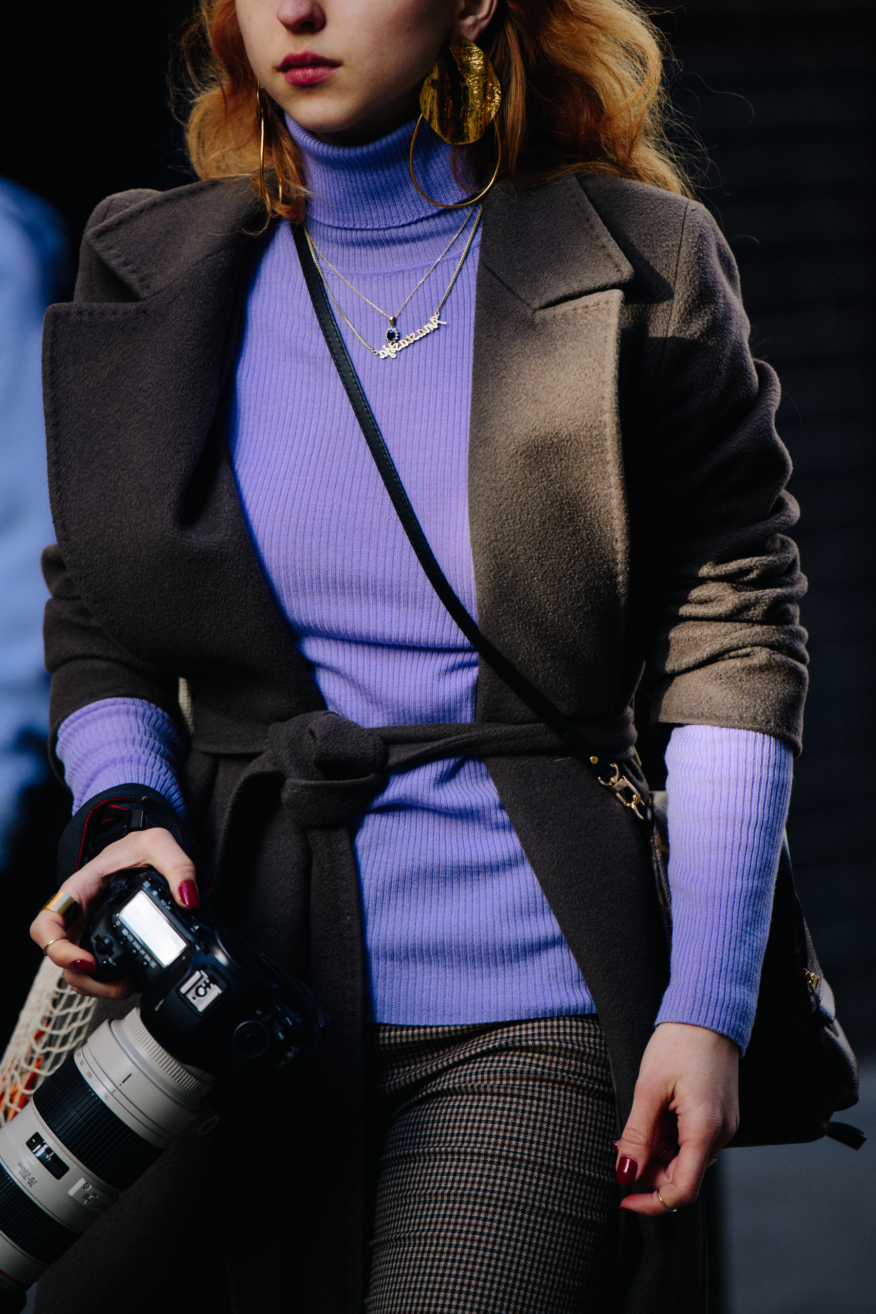 Woman wearing purple sweater