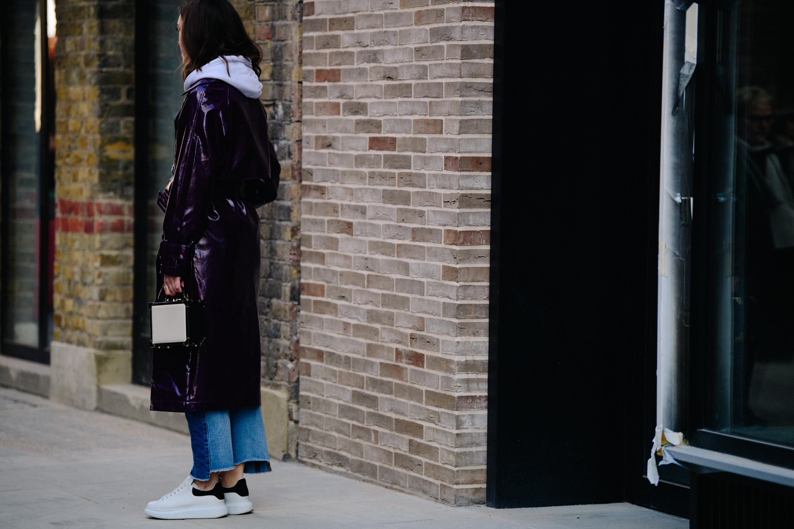 Woman wearing long purple coat