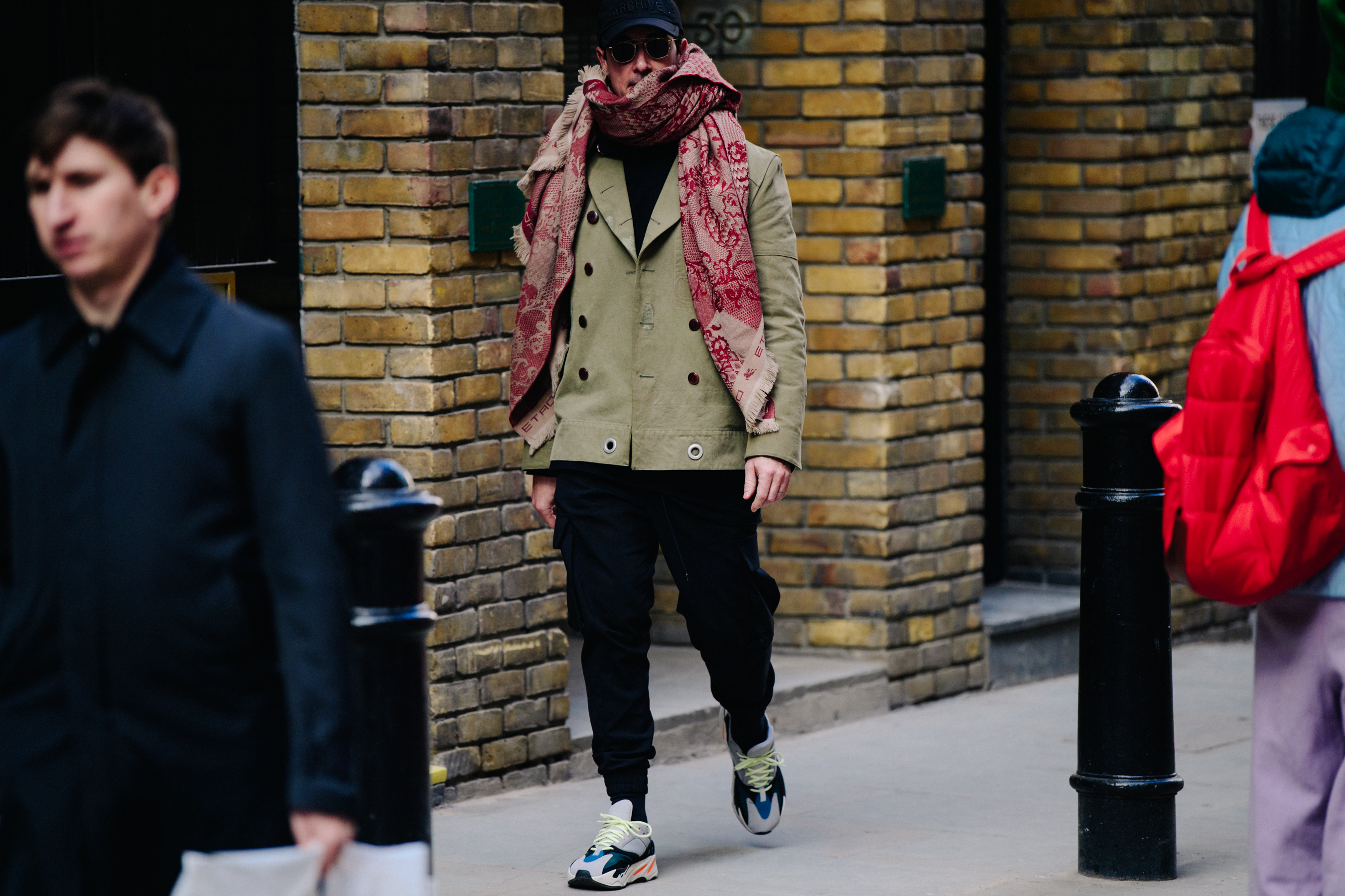 Man wearing Adidas sneakers