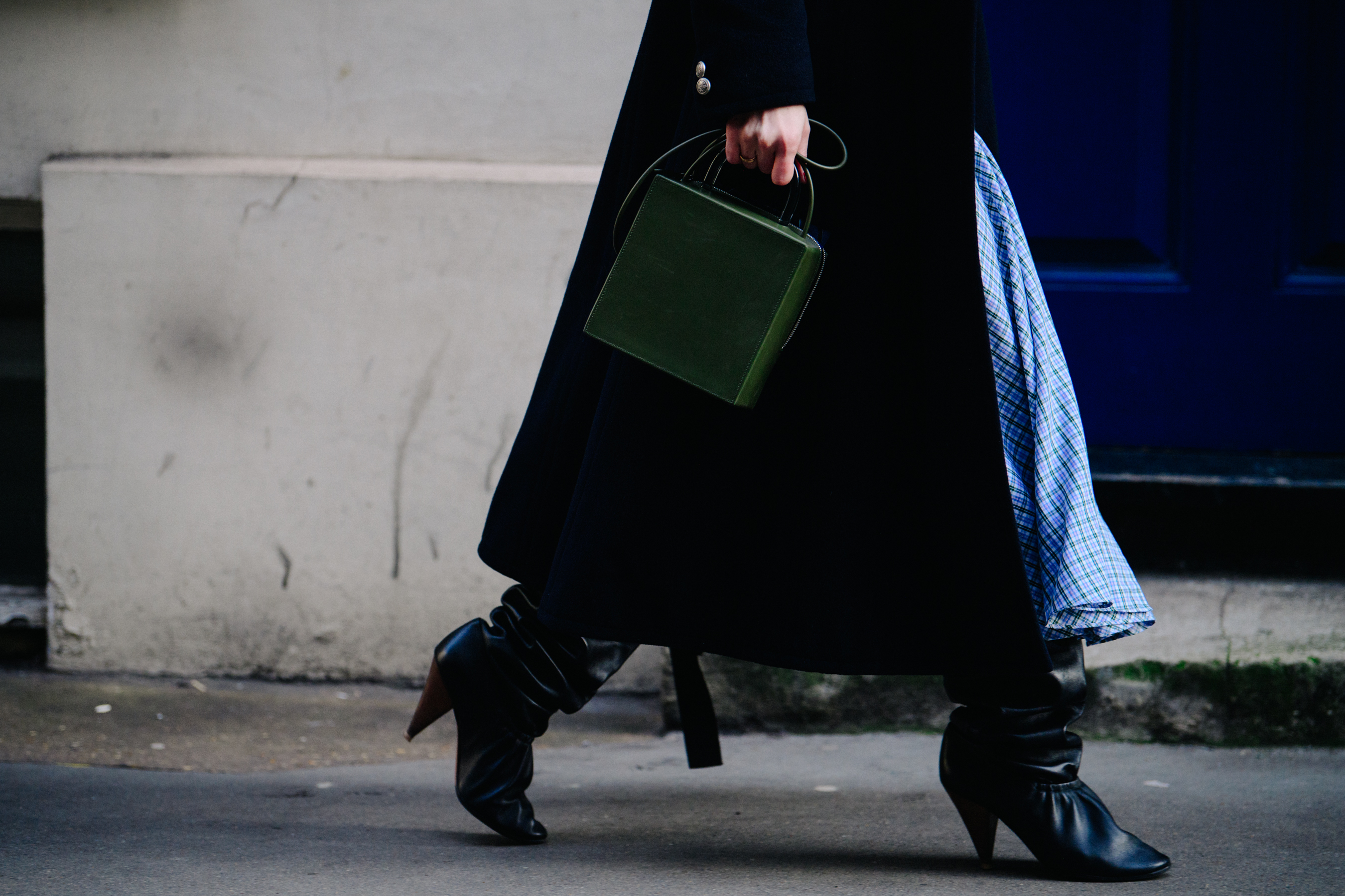 Woman carrying green bag