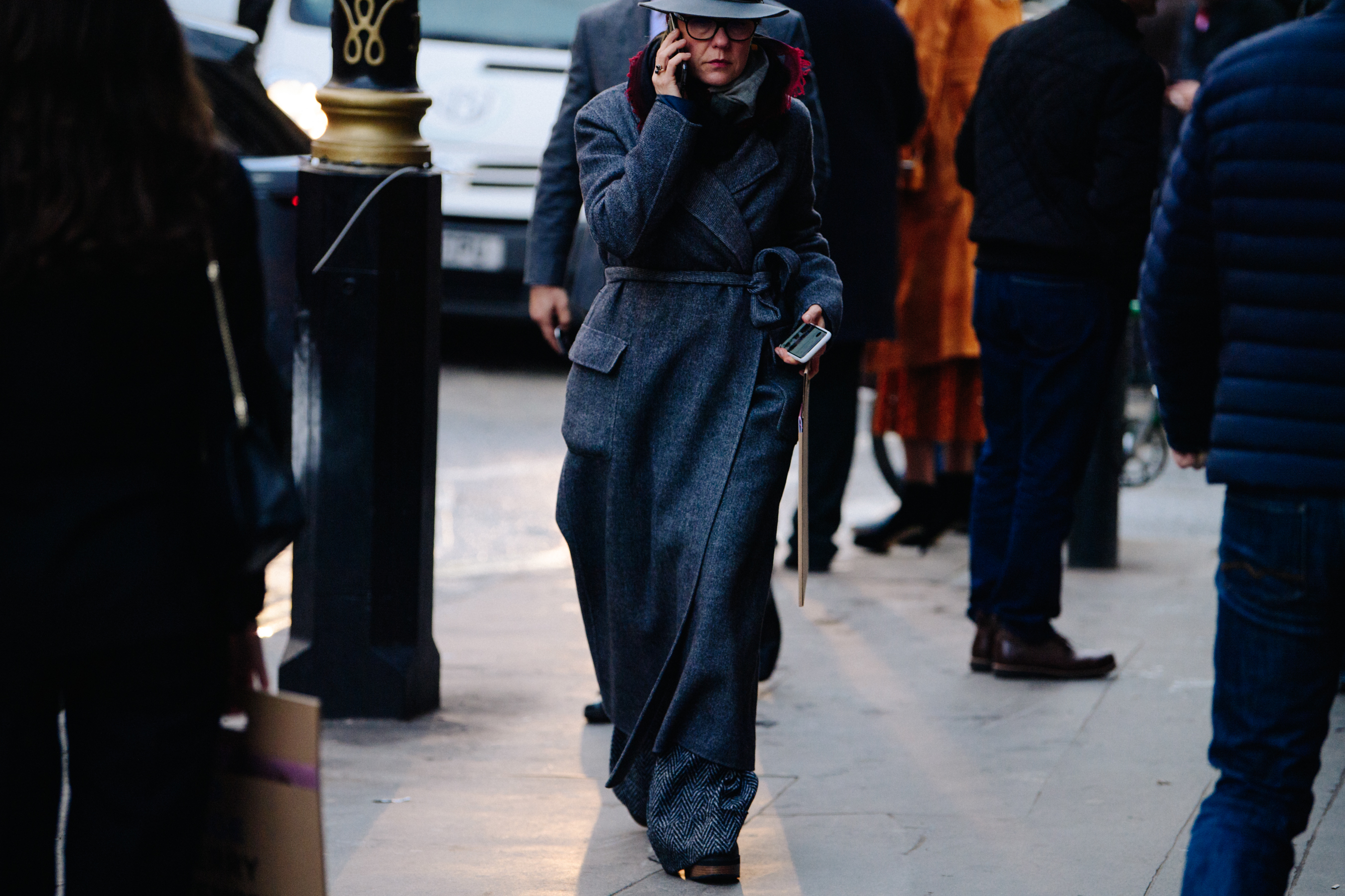 Woman wearing long grey coat