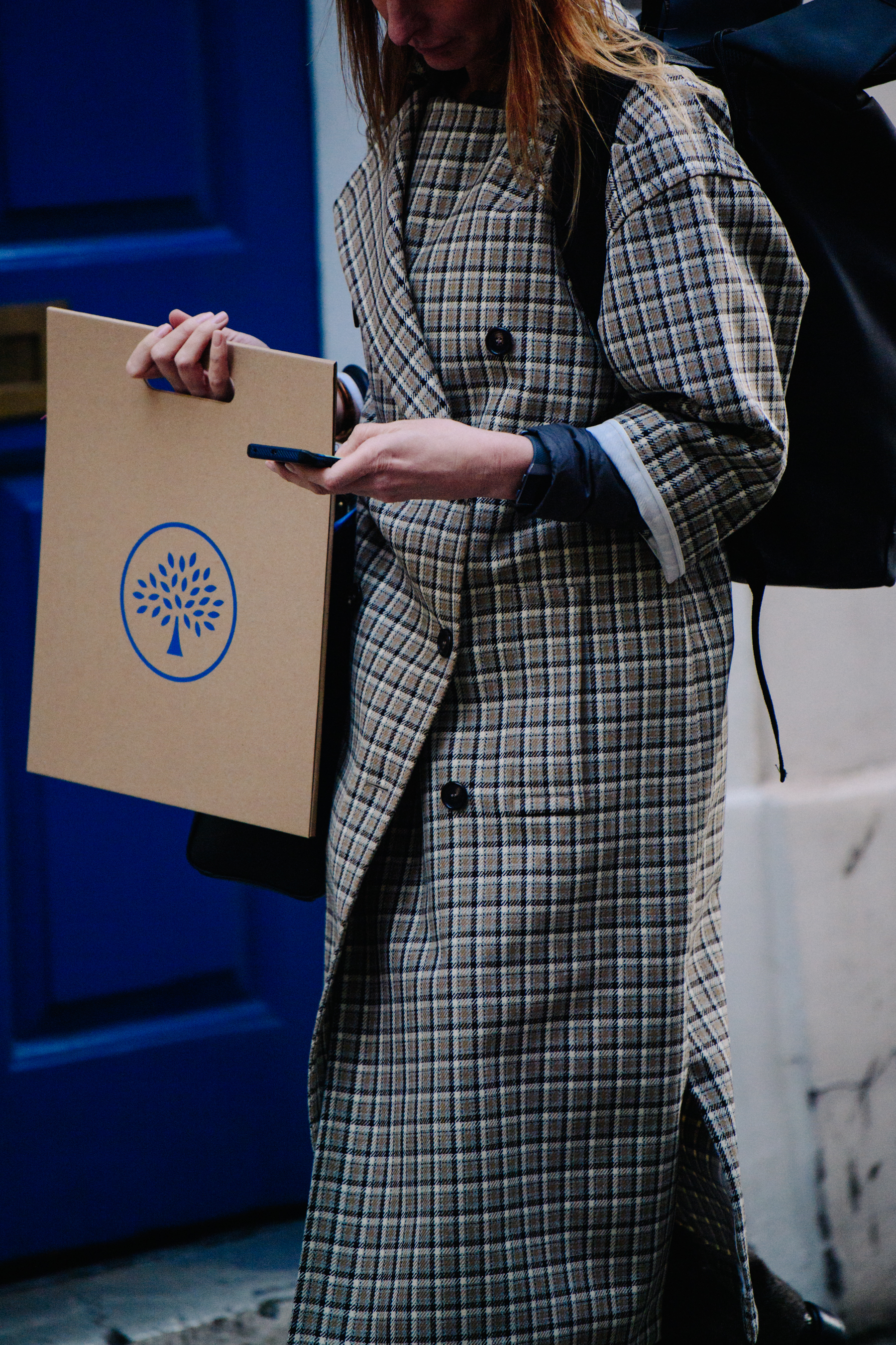 Woman wearing check coat