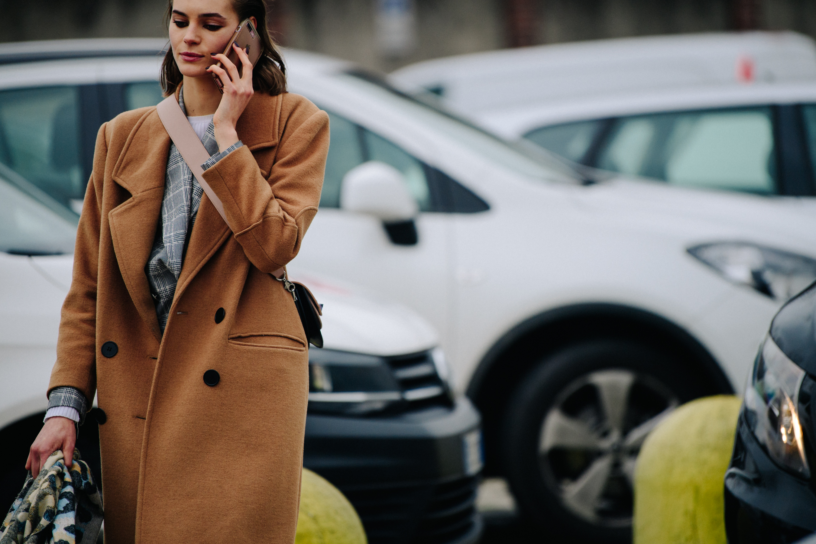 Model wearing camel wool coat