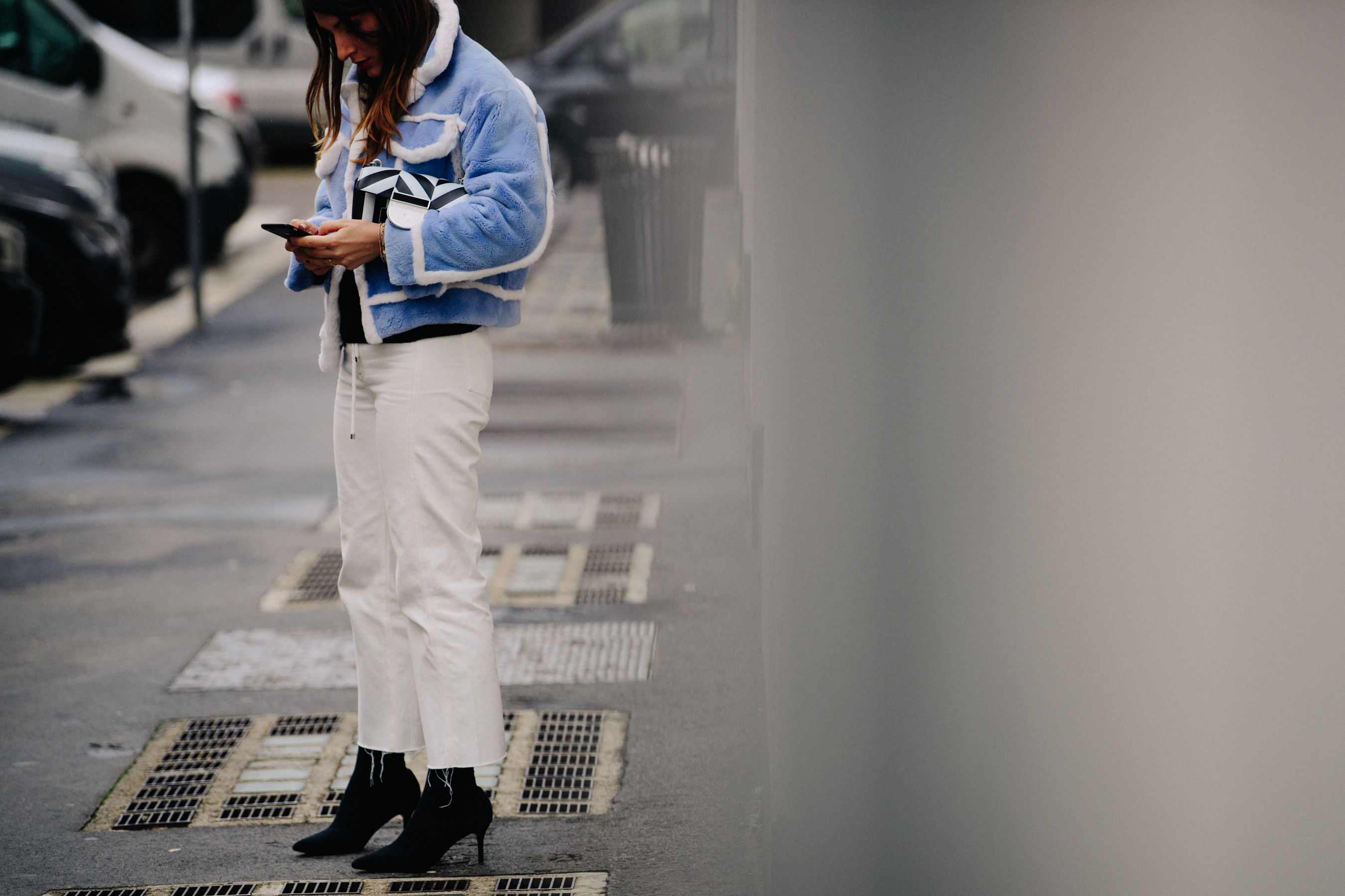 Woman wearing blue fur jacket