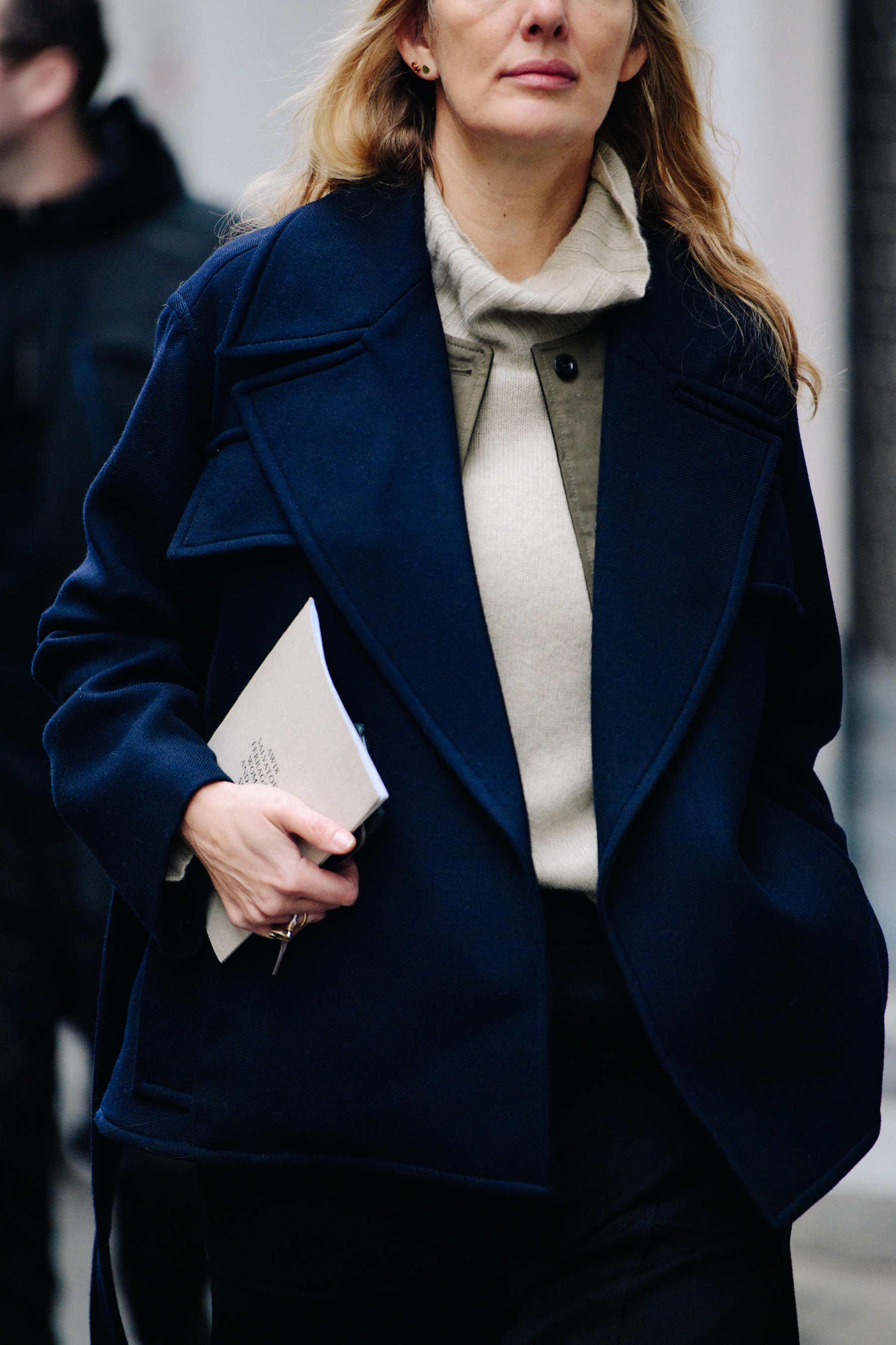 Woman wearing navy wool jacket
