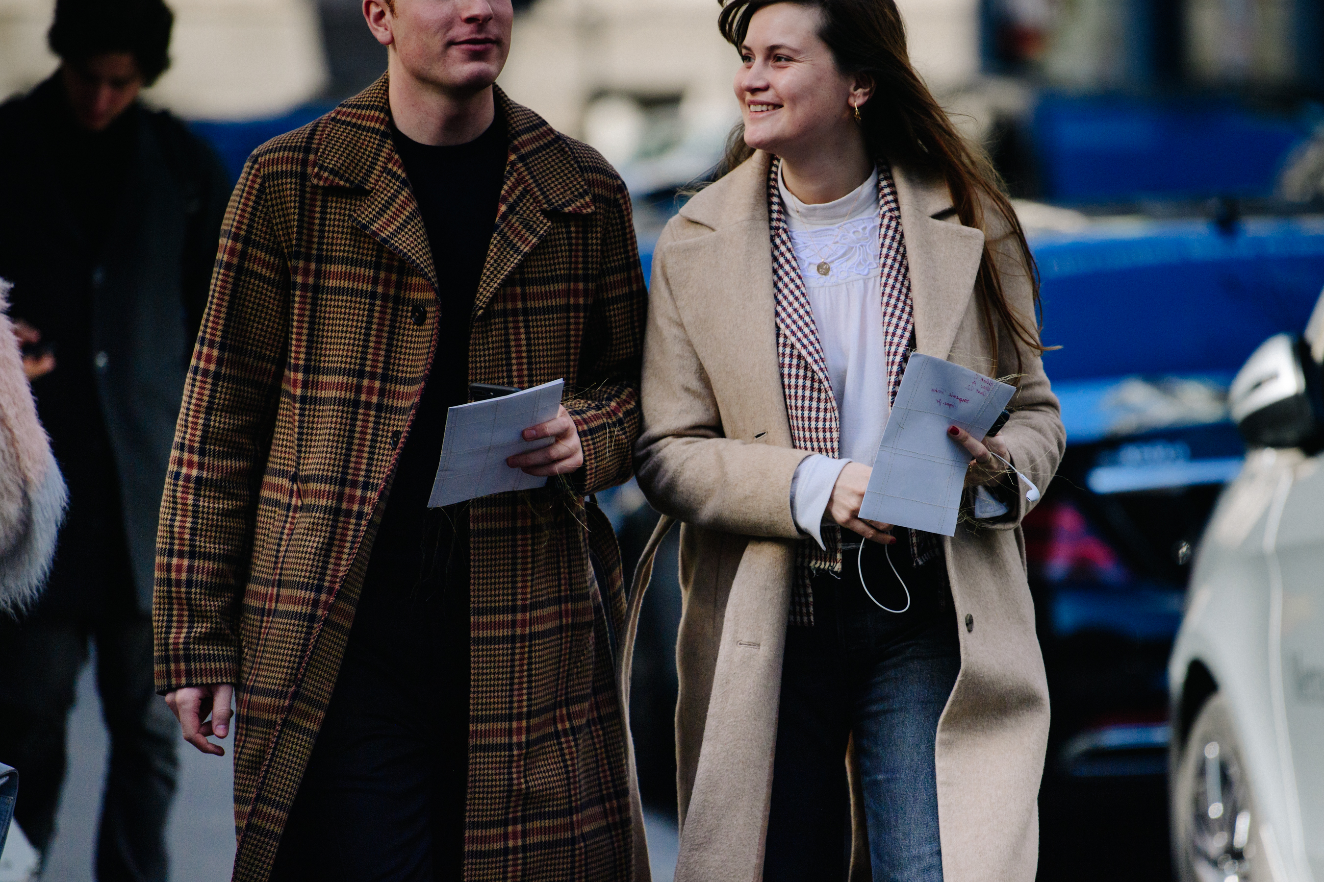 Couple wearing herringbone coats