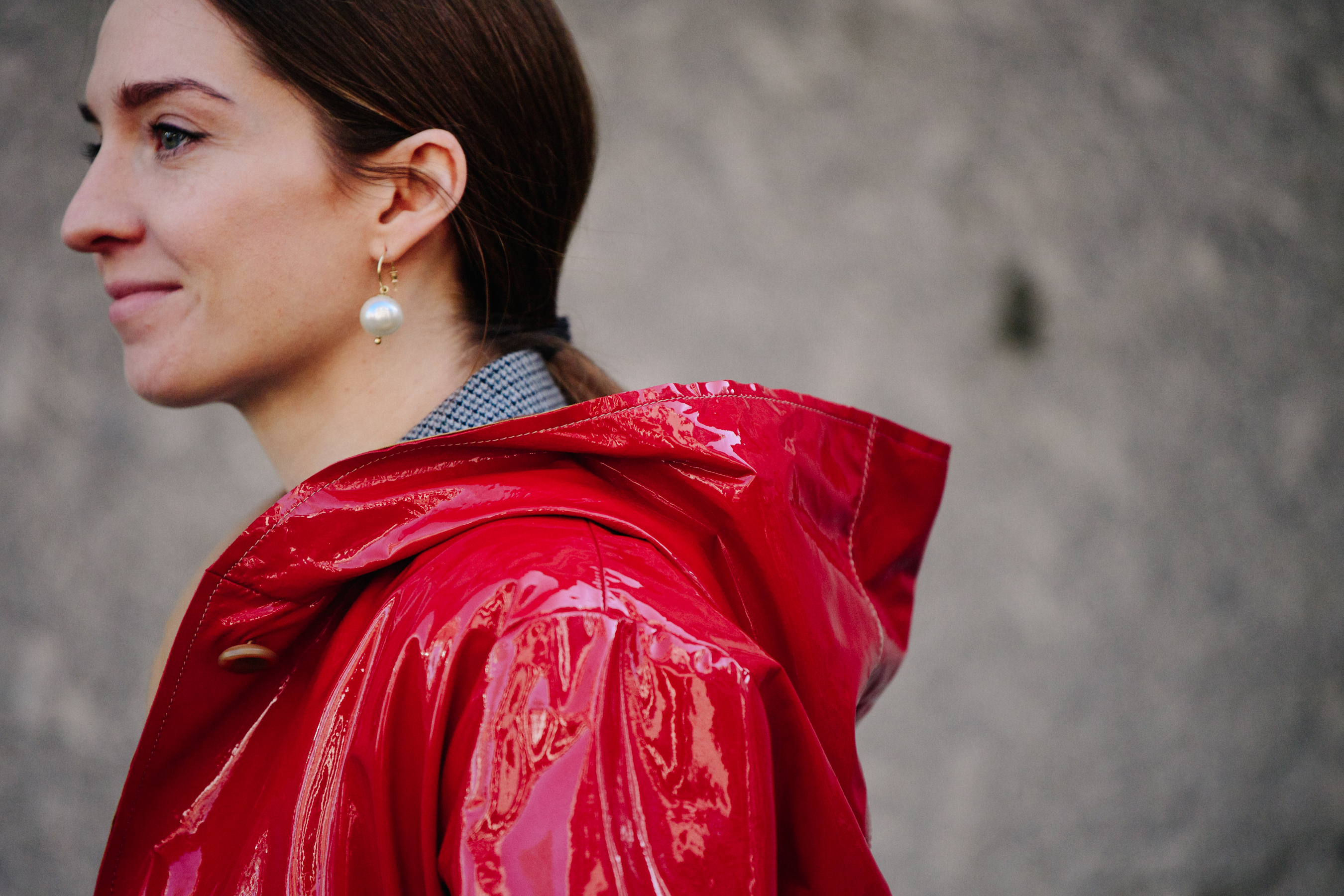 Woman wearing red patent coat