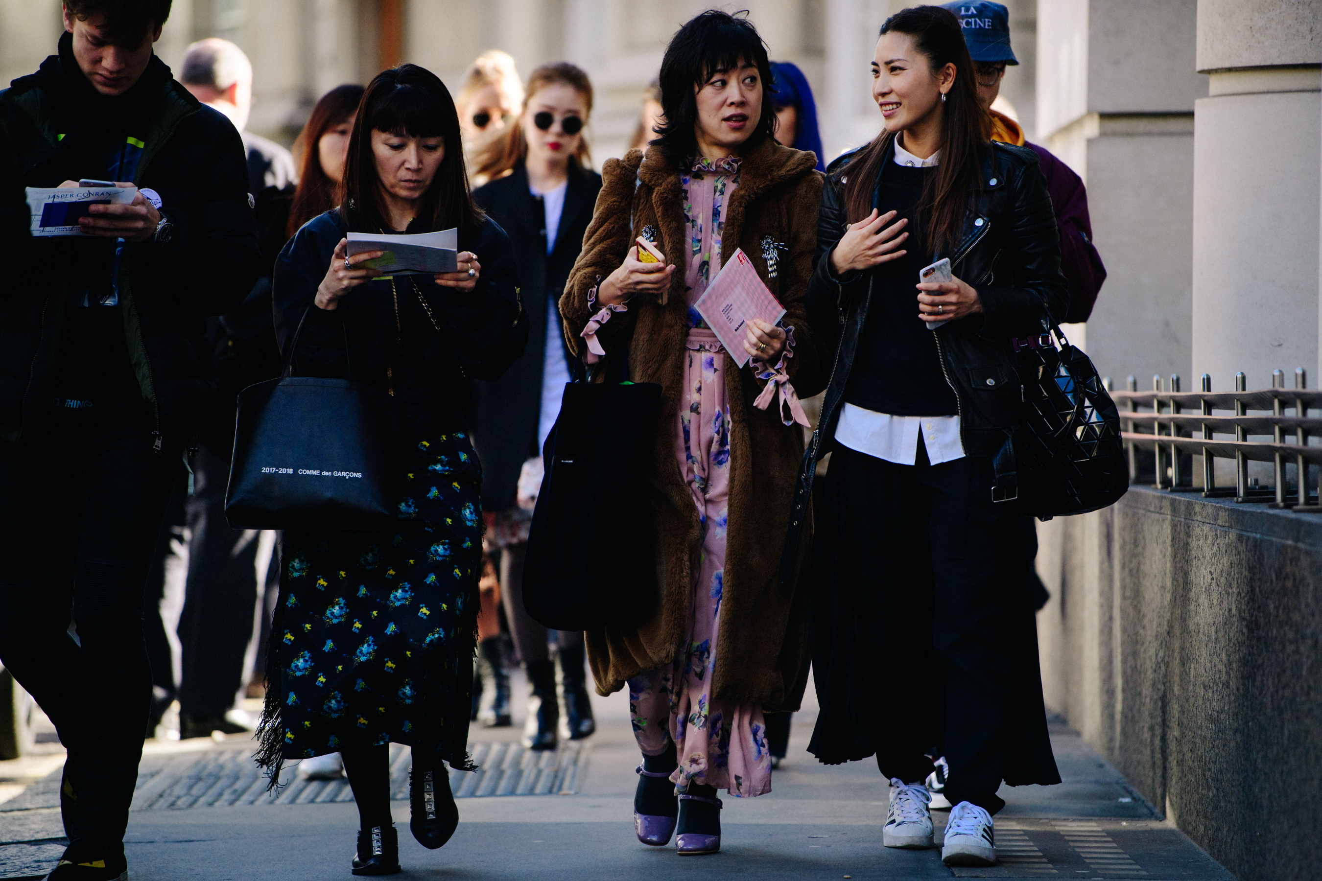 Group of Asian women wearing long dresses