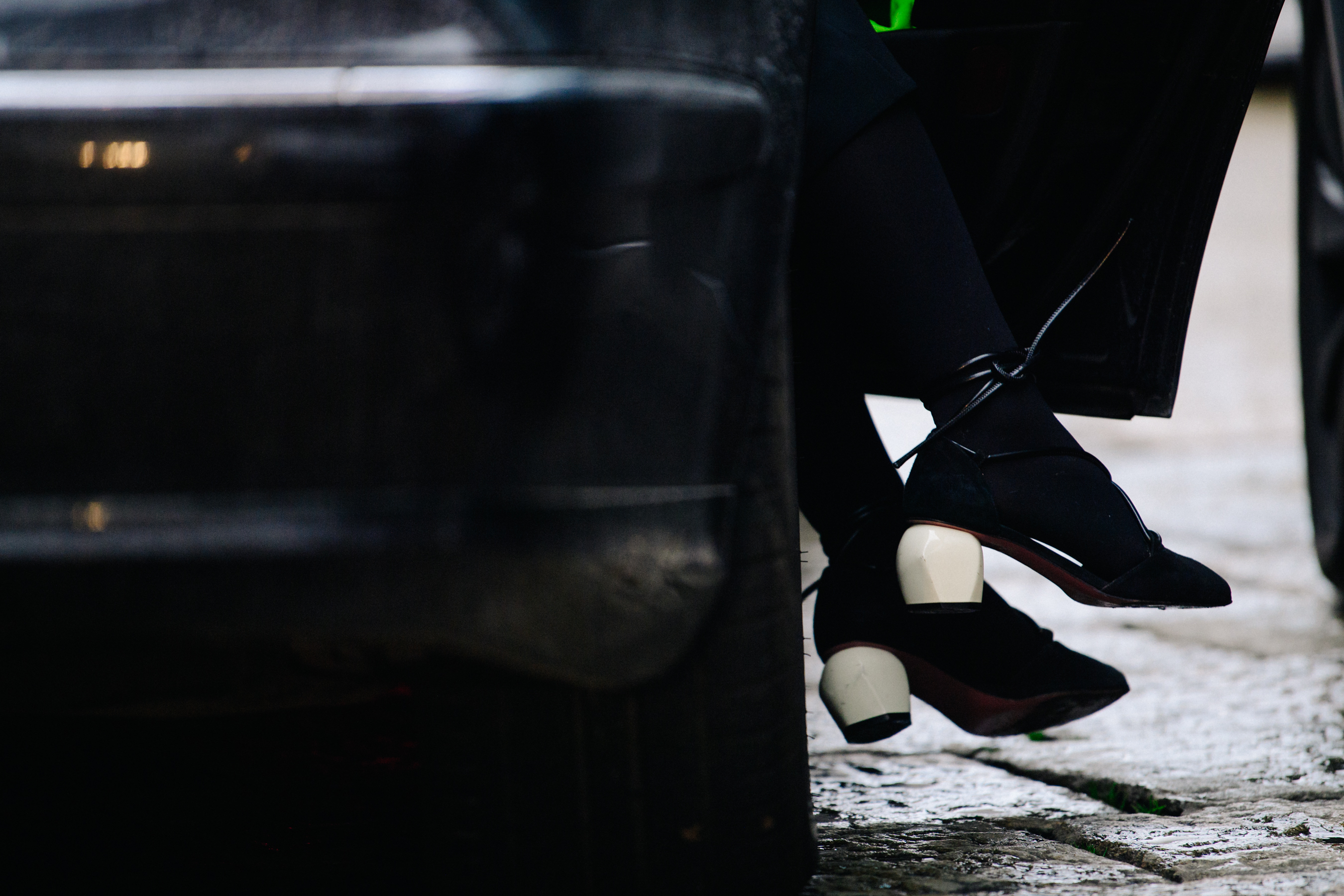 Woman wearing black and white heels