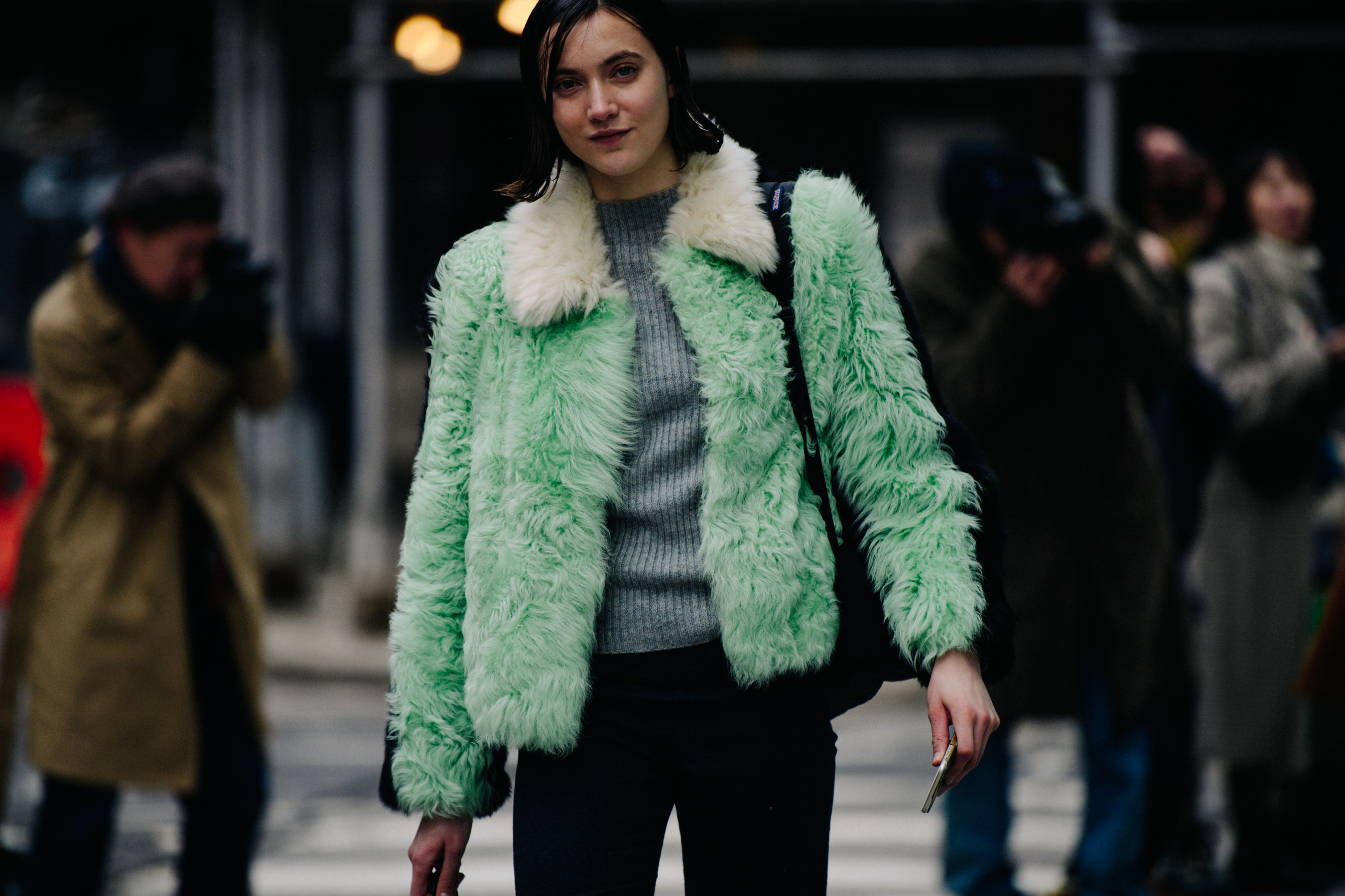 Model wearing green fur jacket