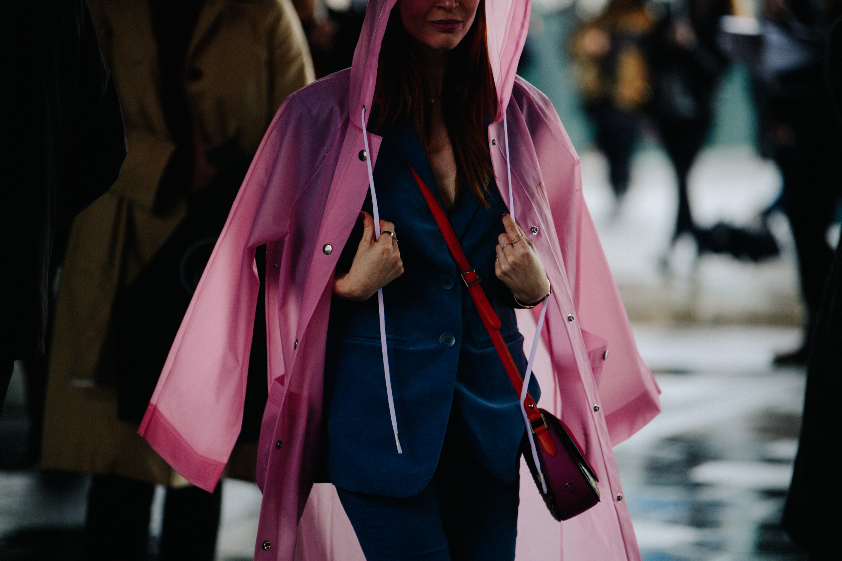 Woman wearing pink raincoat