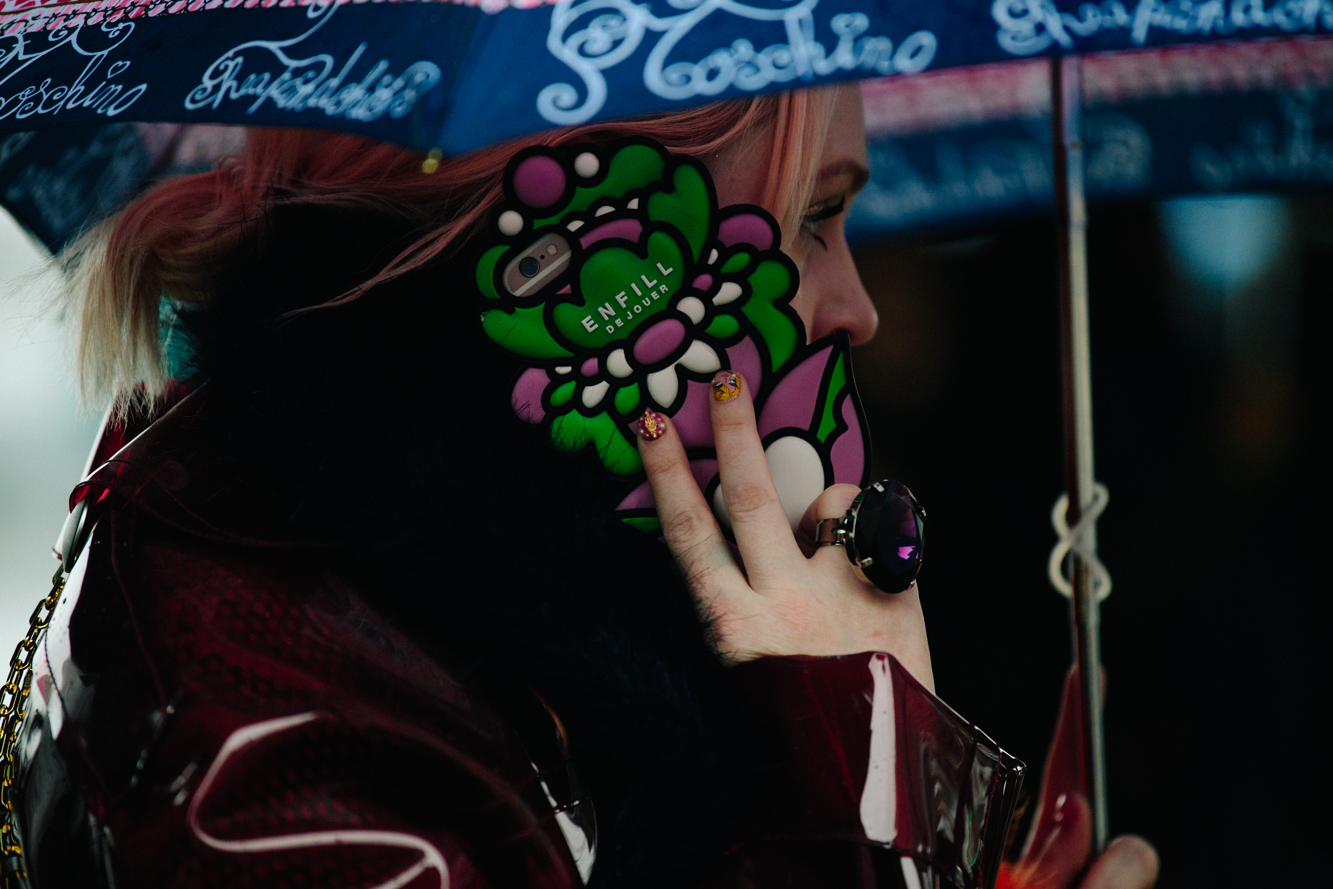 Woman using iPhone with colourful case