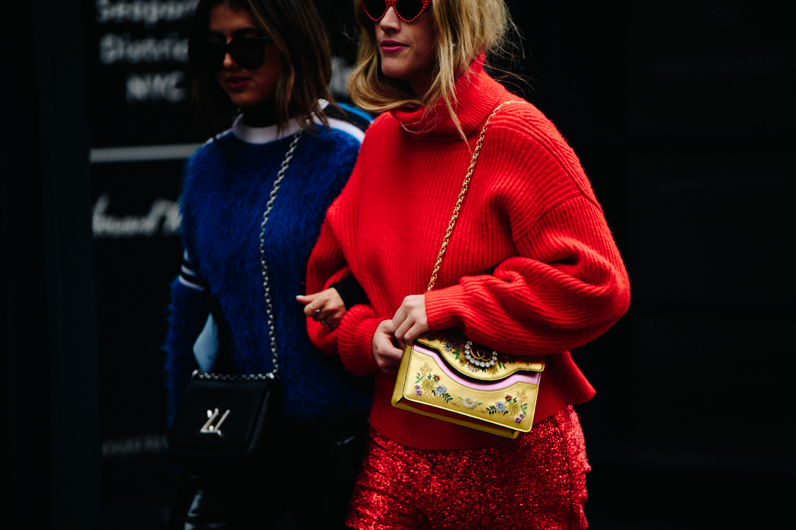 Two women wearing red and blue