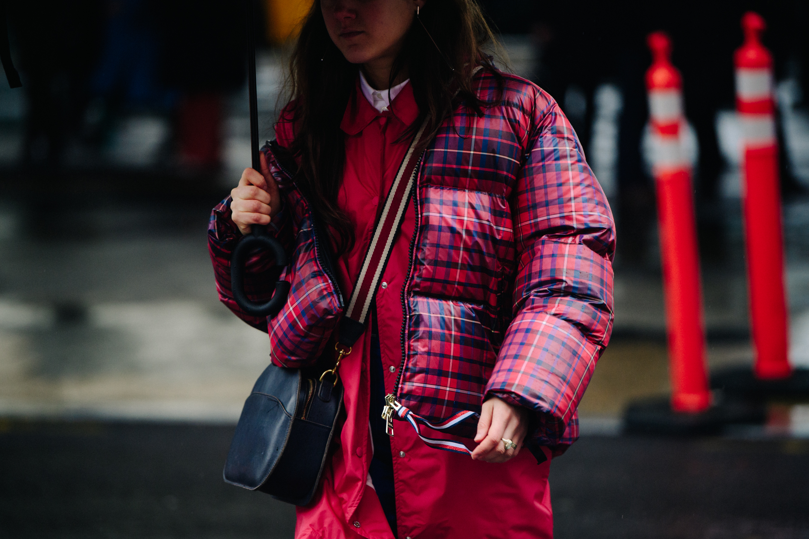 Woman wearing red check jacket