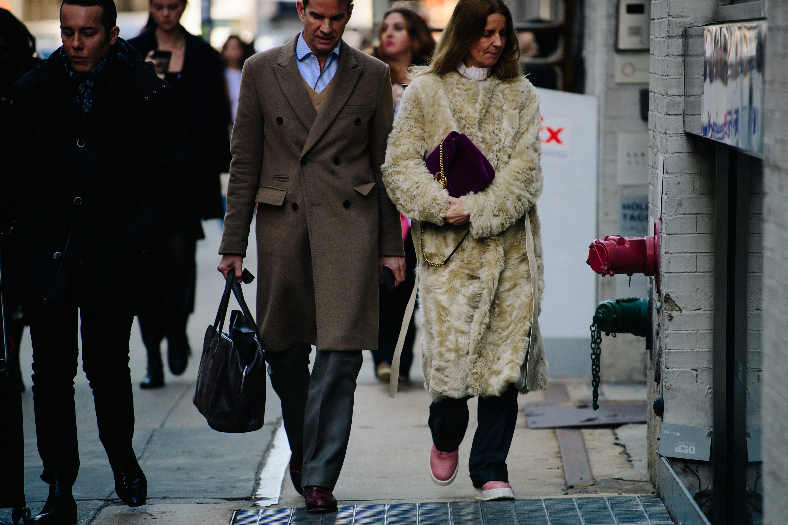 Couple wearing light coloured coats