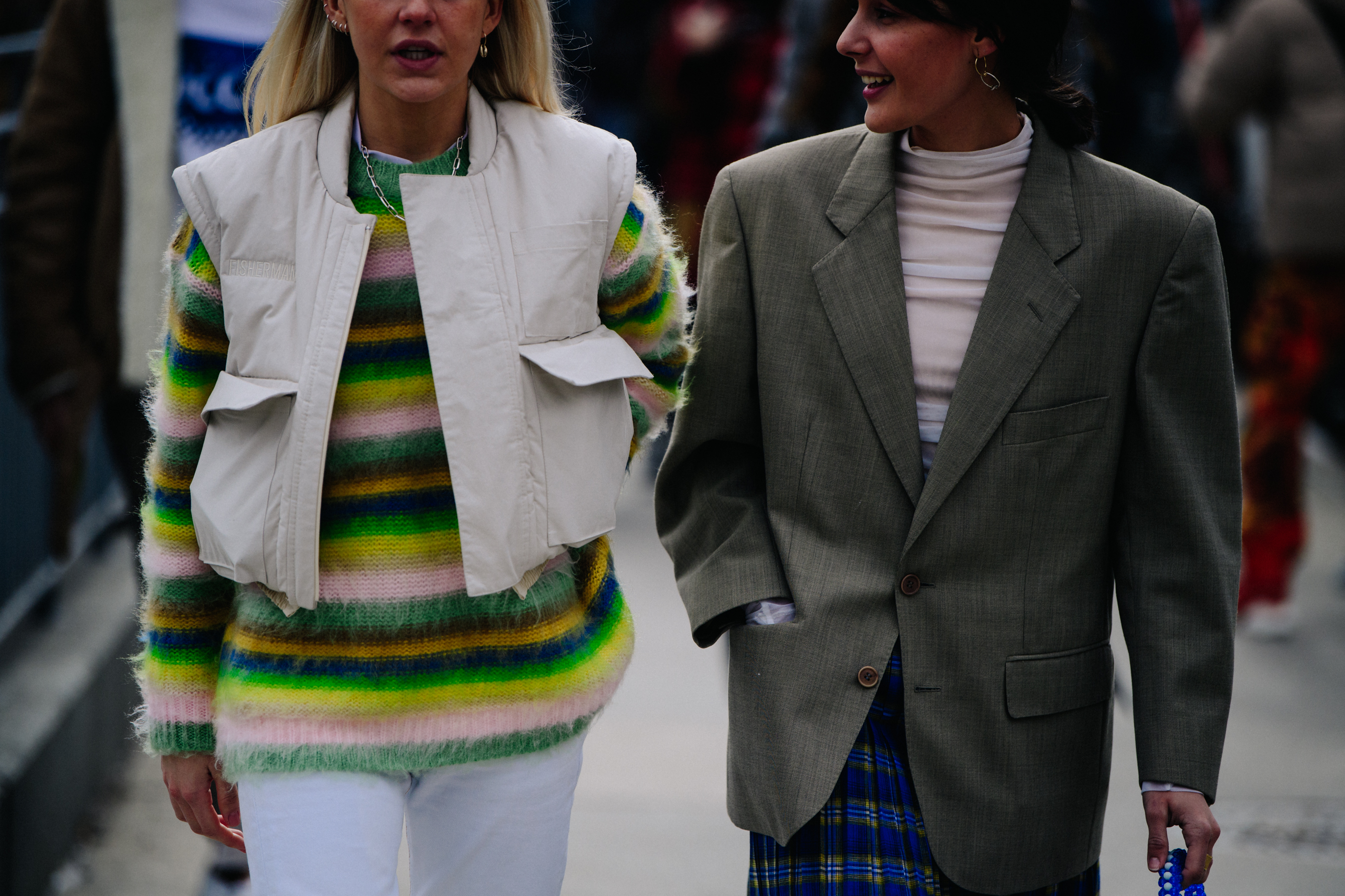 Two women wearing light jackets