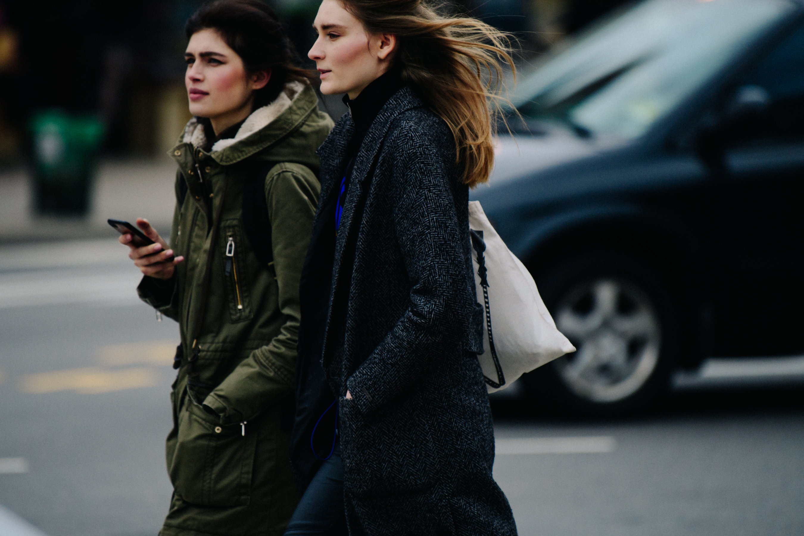 Two models wearing winter coats