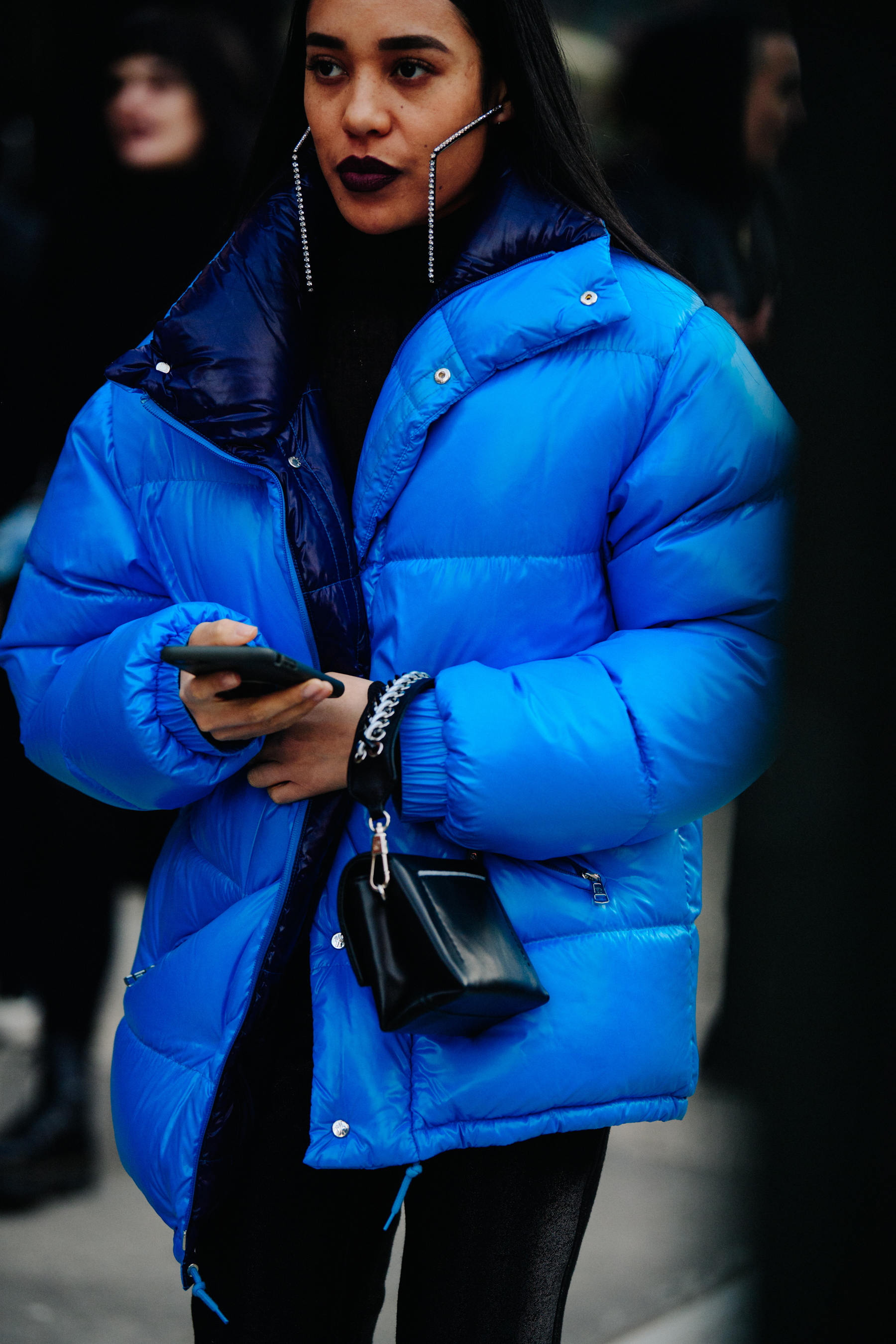 Woman wearing blue puffer coat