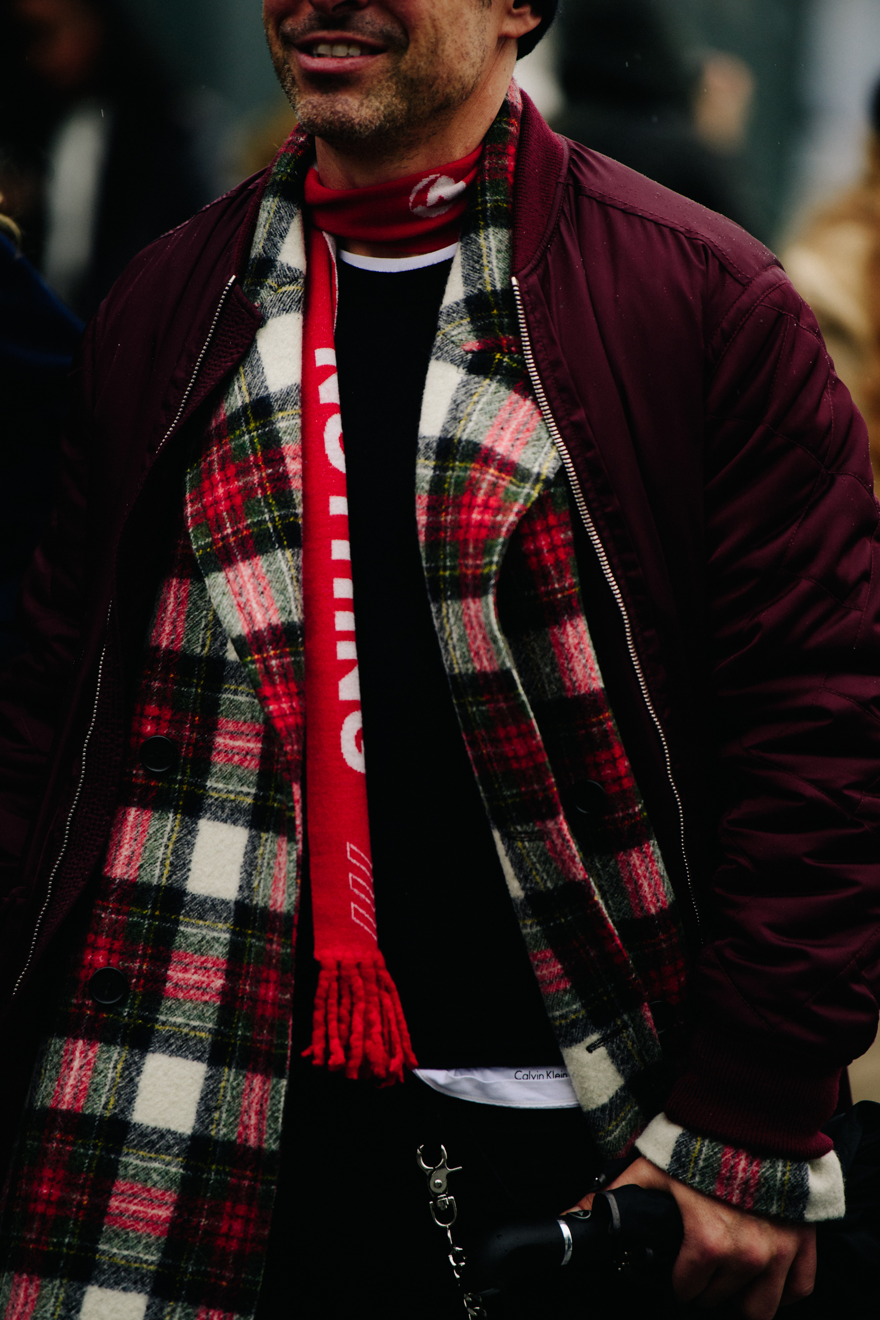 Man wearing red and white scarf