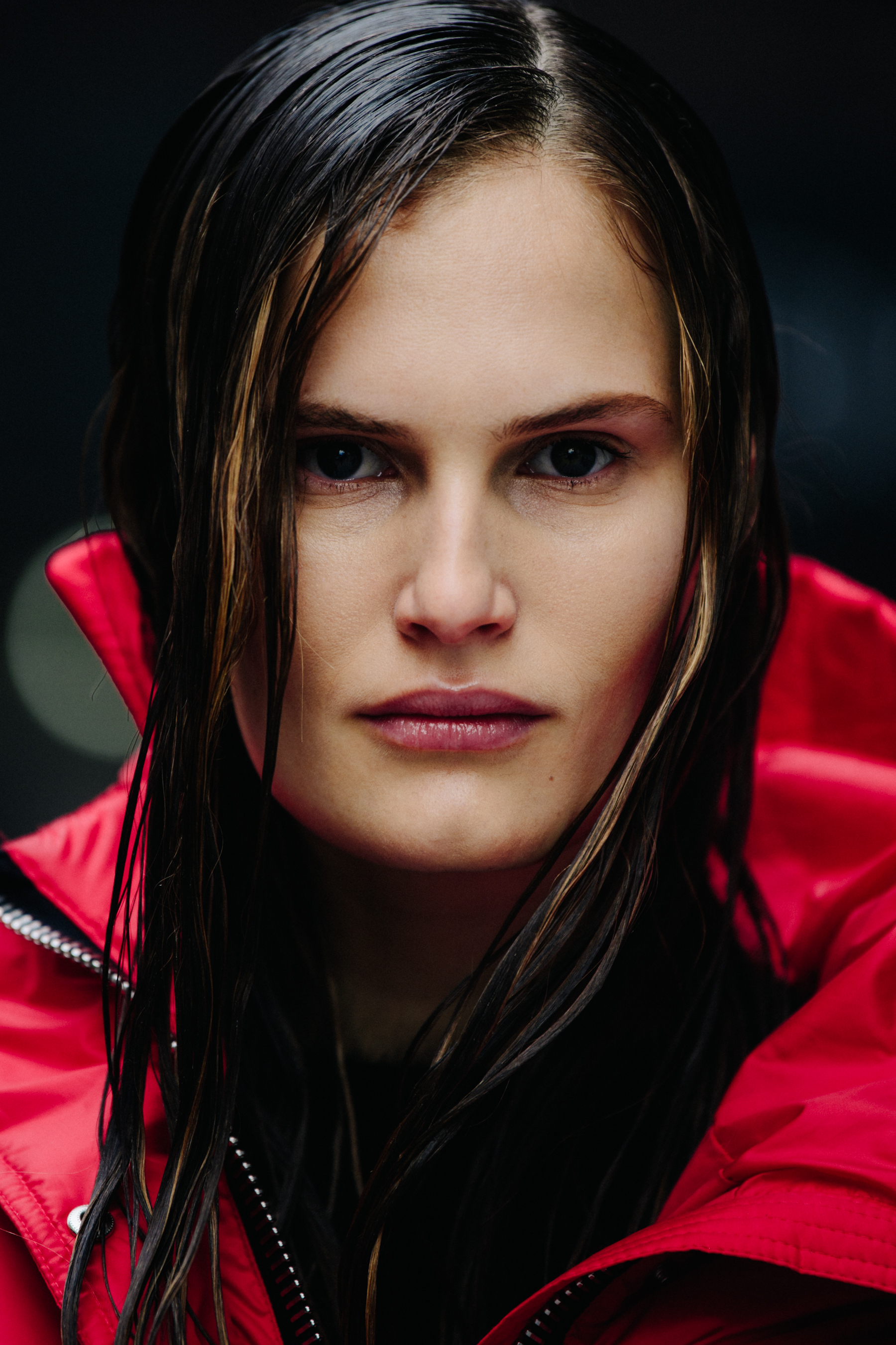 Portrait of model wearing red coat