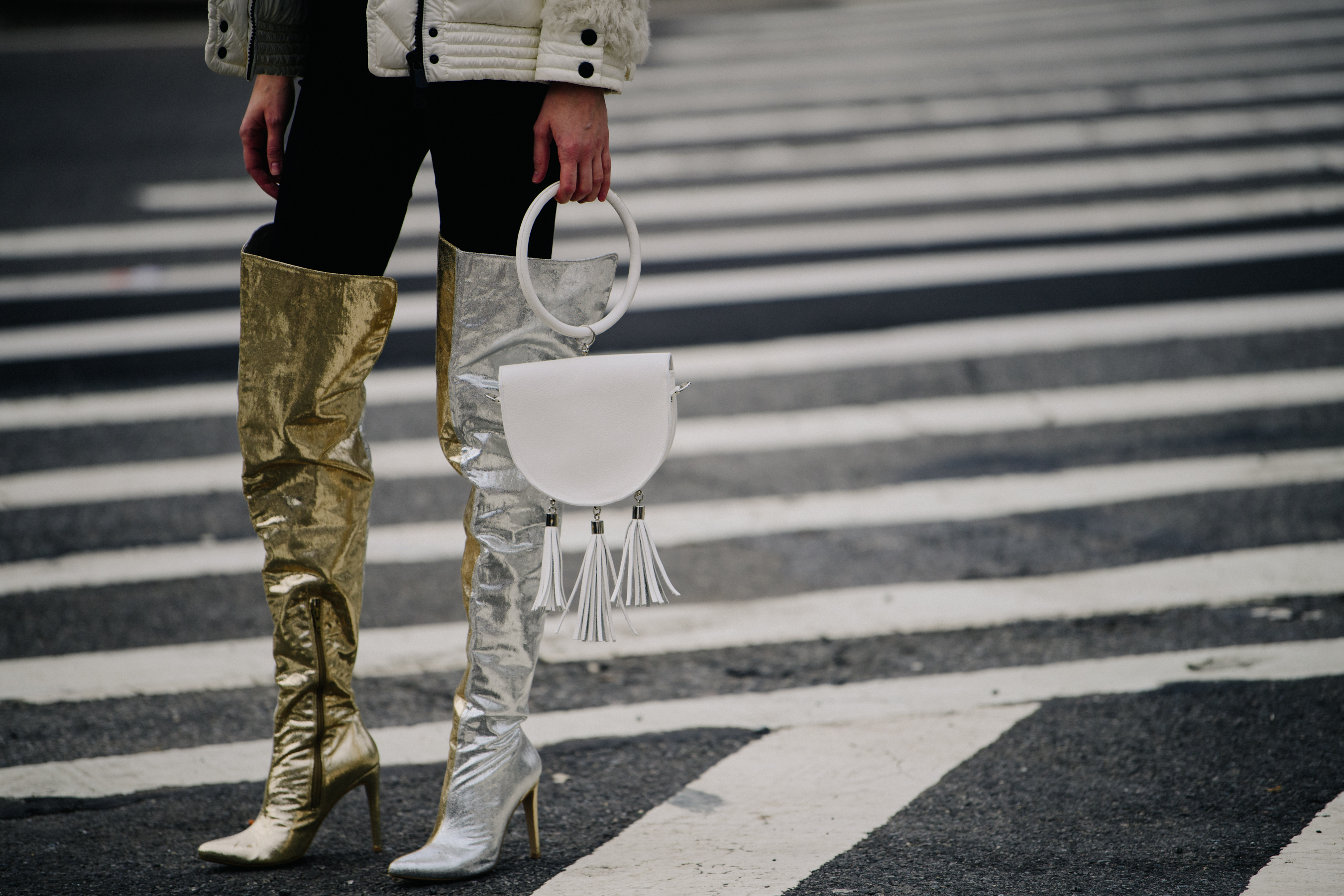 Woman wearing silver and gold boots