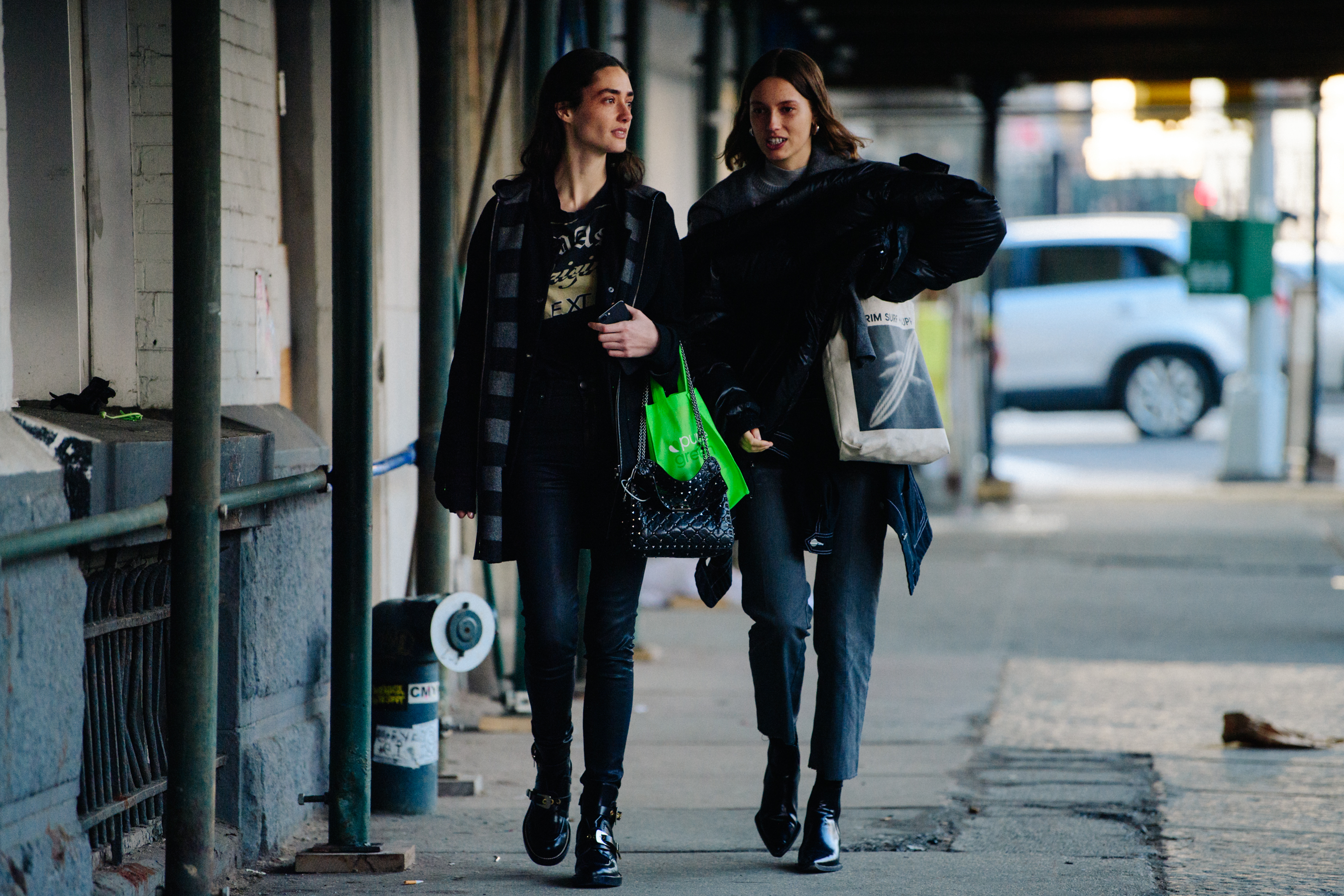Two models wearing black