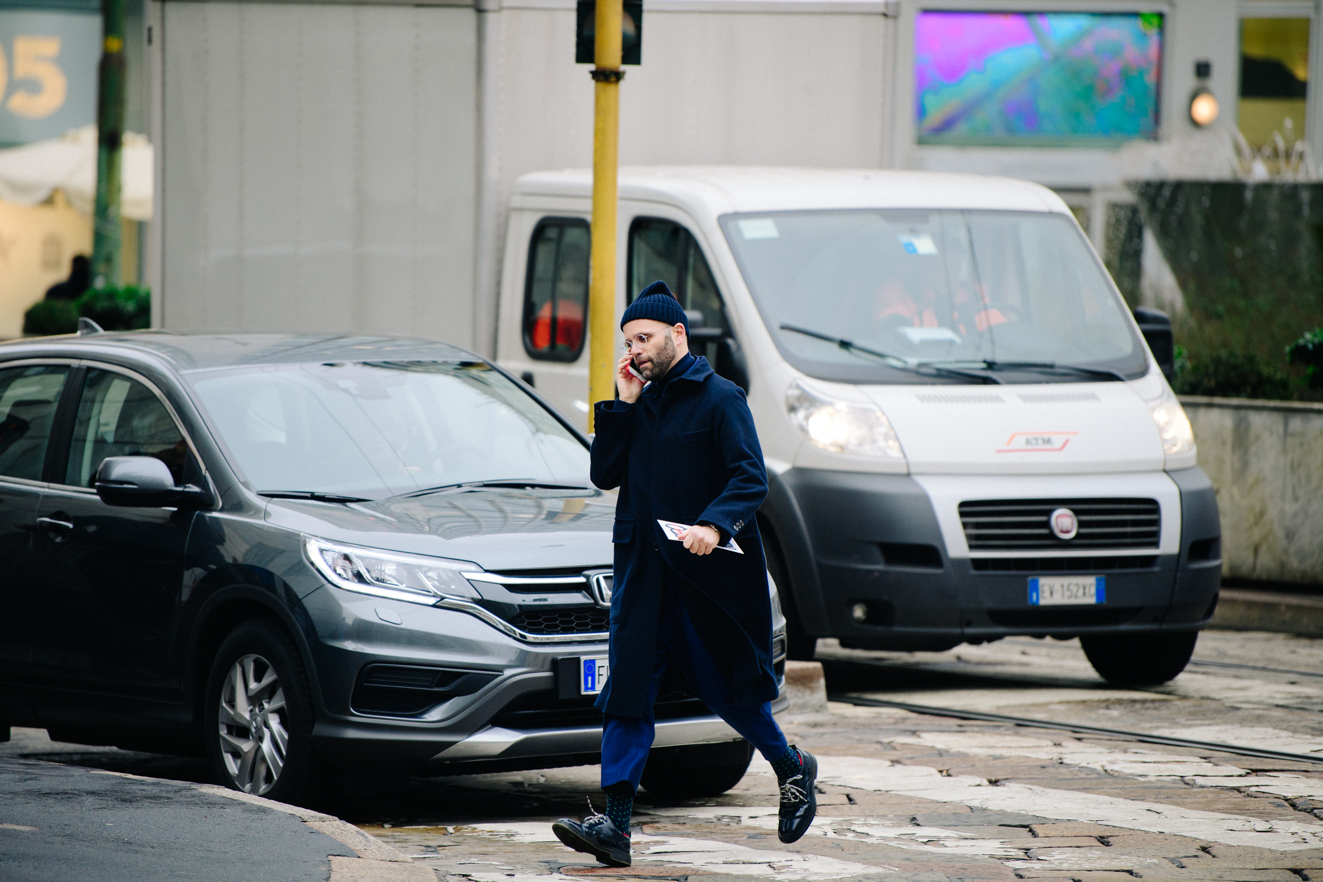 Italian man wearing blue coat and beanie