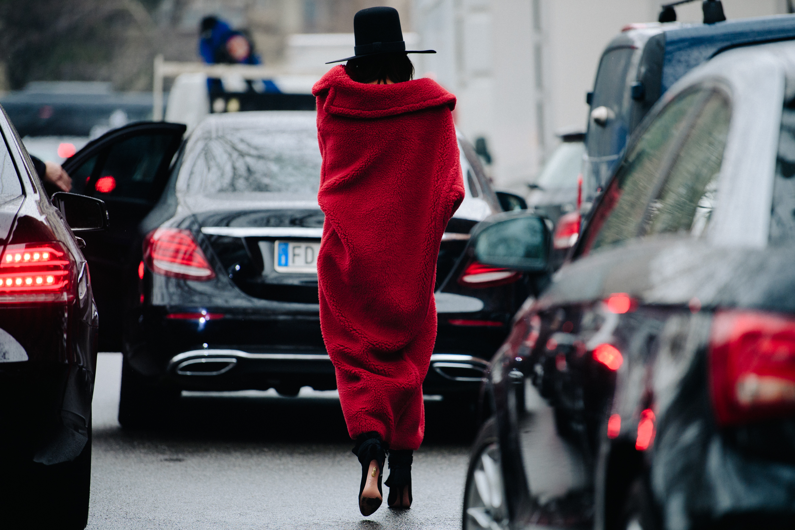 Italian editor wearing red fur coat