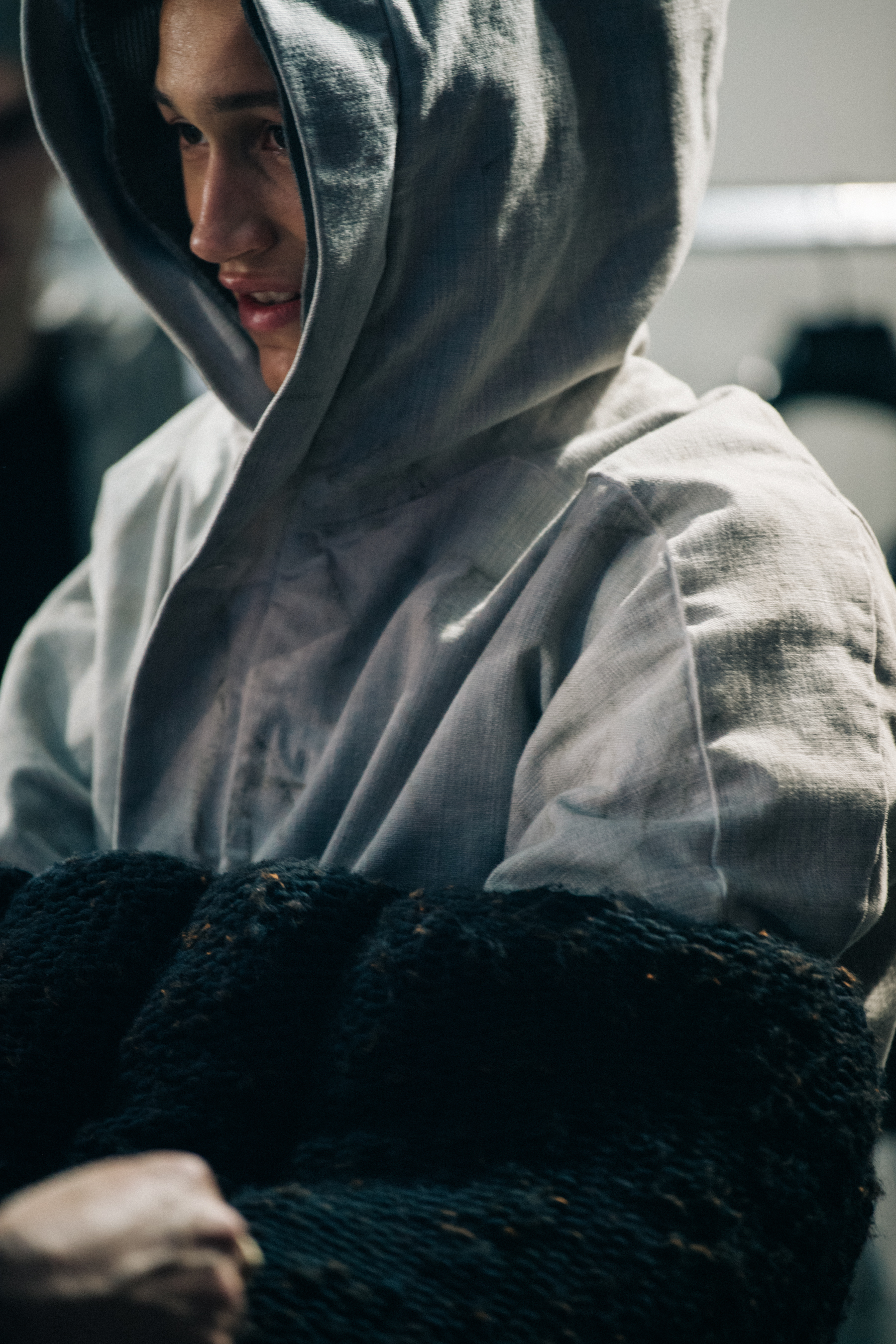 Model wearing Boris BIdjan Saberi coat backstage