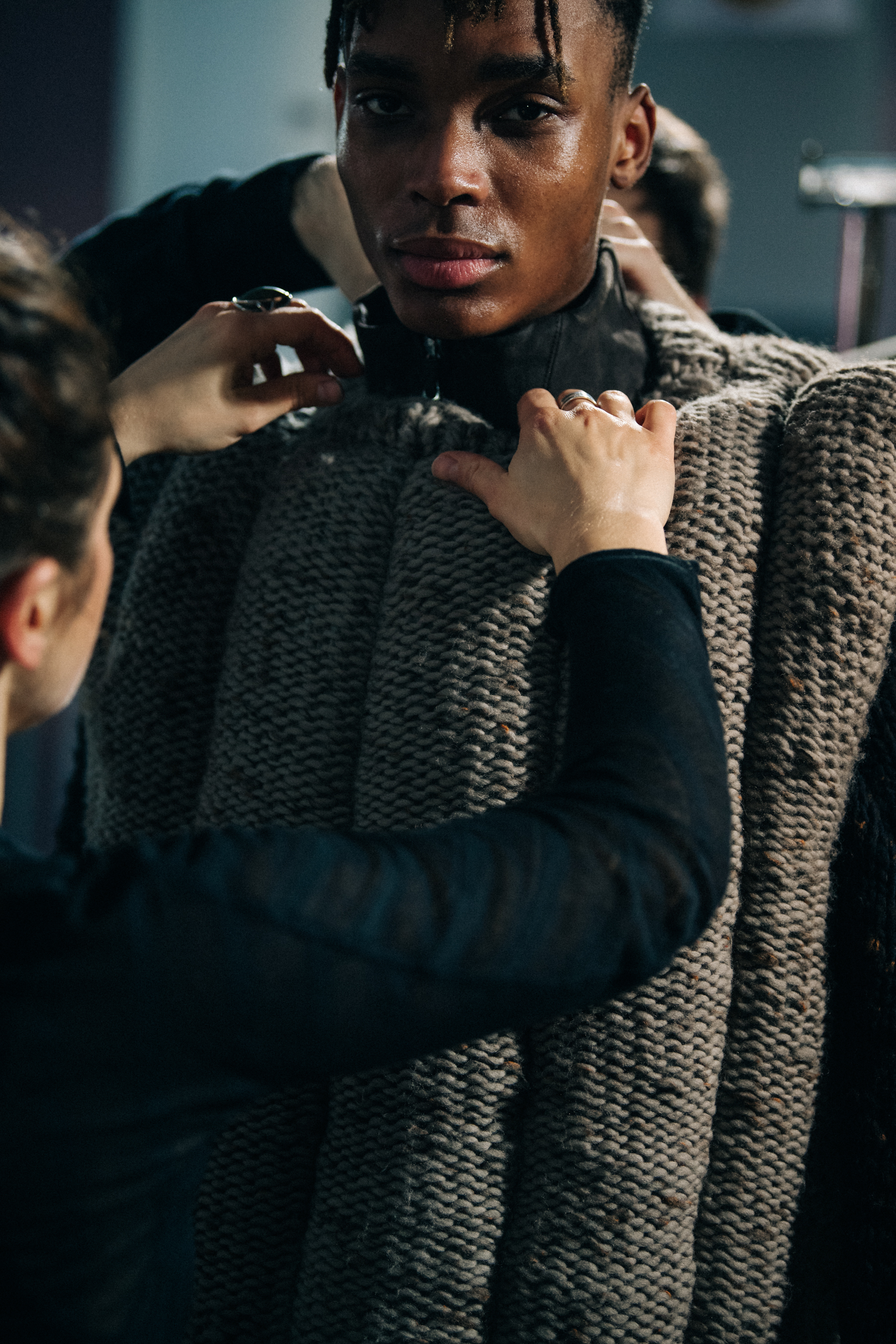 Model wearing grey knit jumper